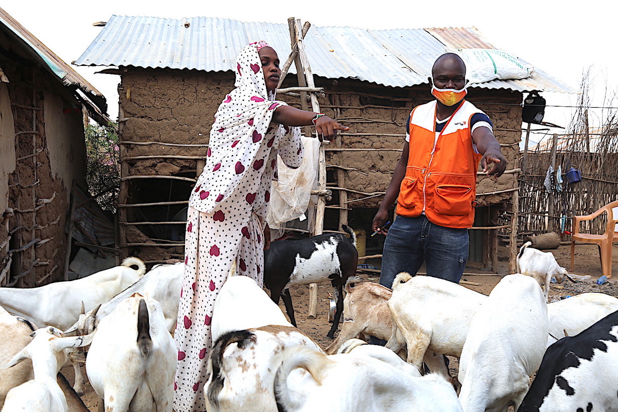 World Vision Staff pays a beneficiary a visit