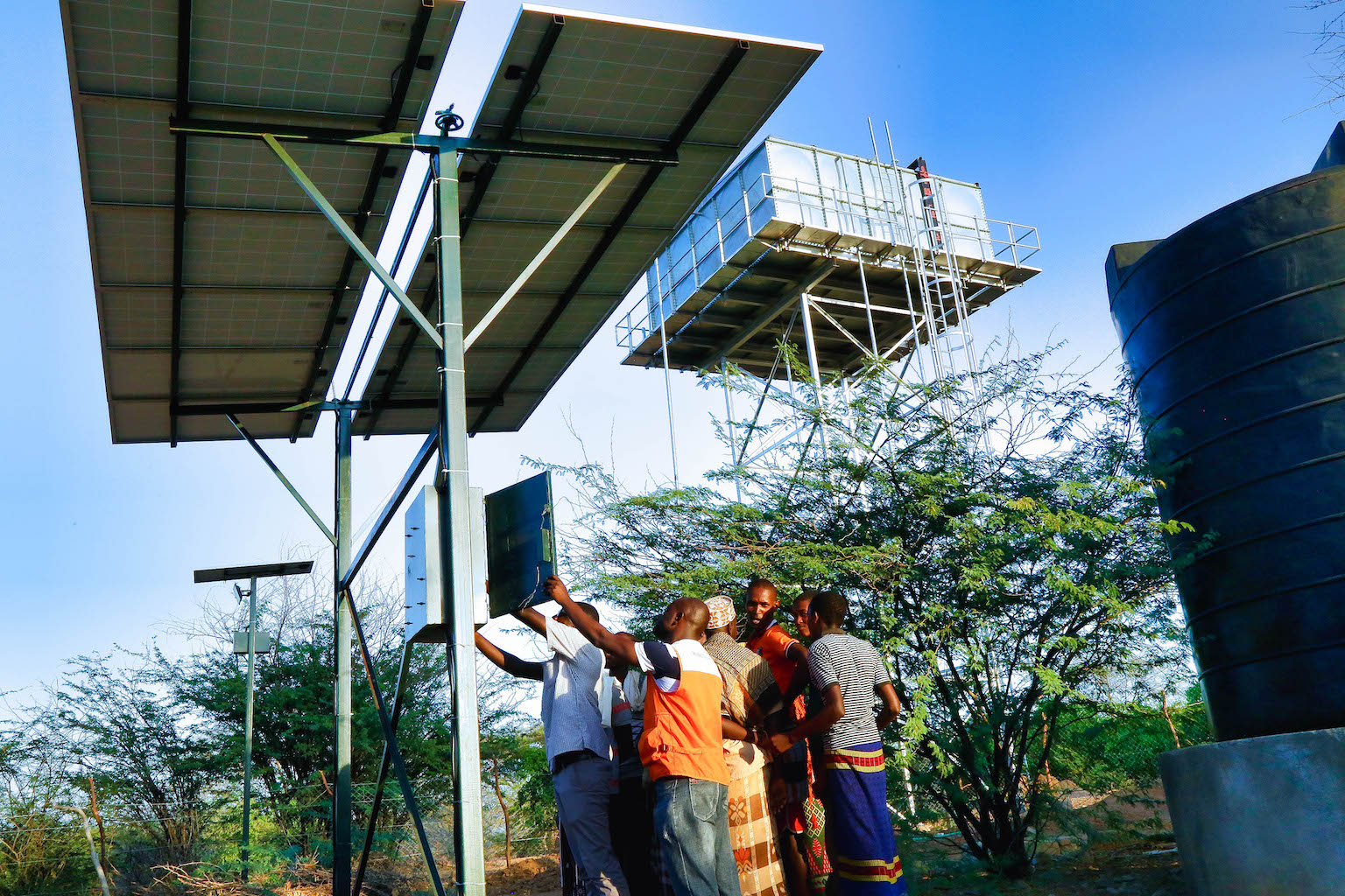 Engineer George and Collins, WVK staff carry out routine maintenance of a water system build and installed by World Vision in Wolesereya, Tana River County.