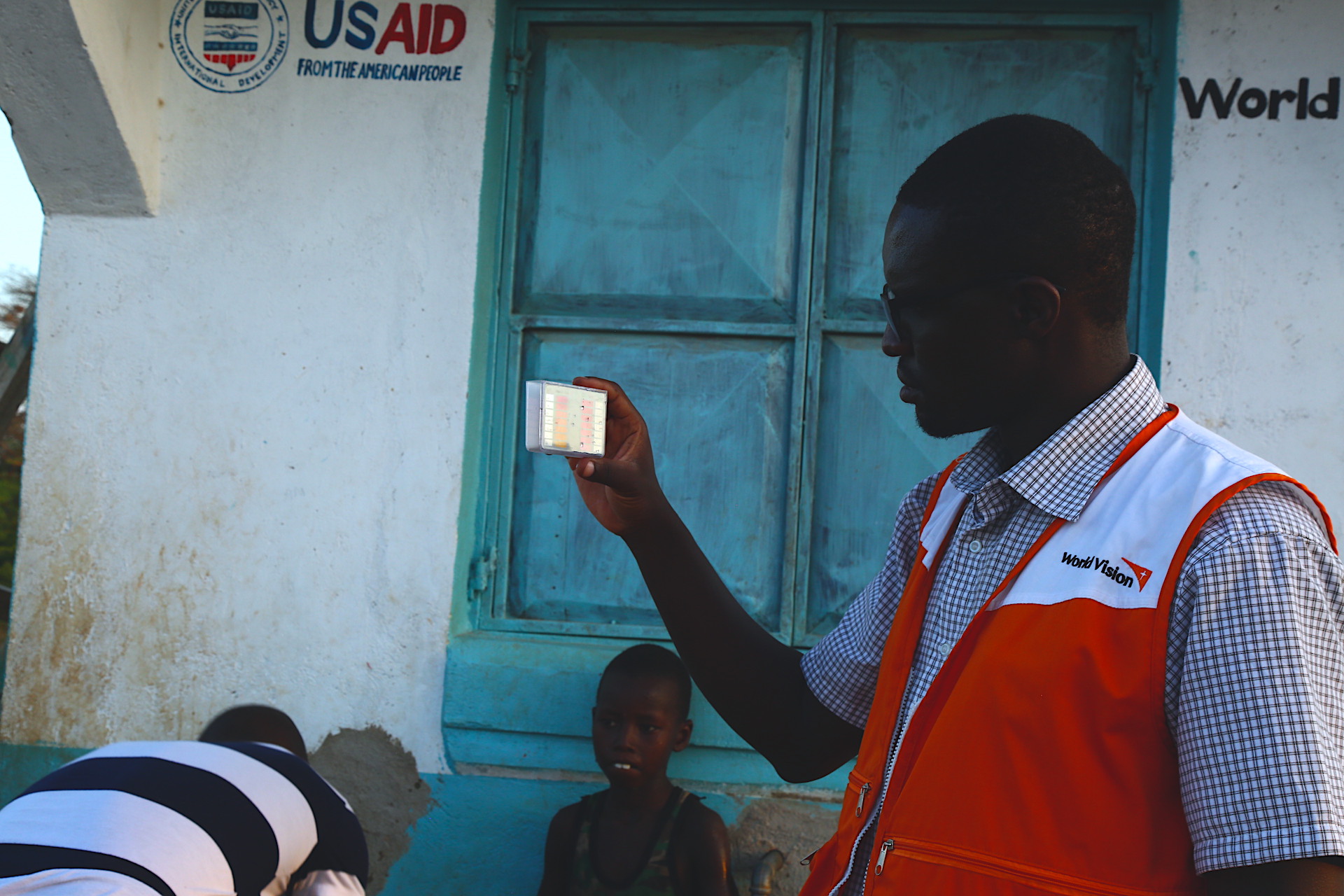 Eng. George (World vision Staff) carries of water analysis 