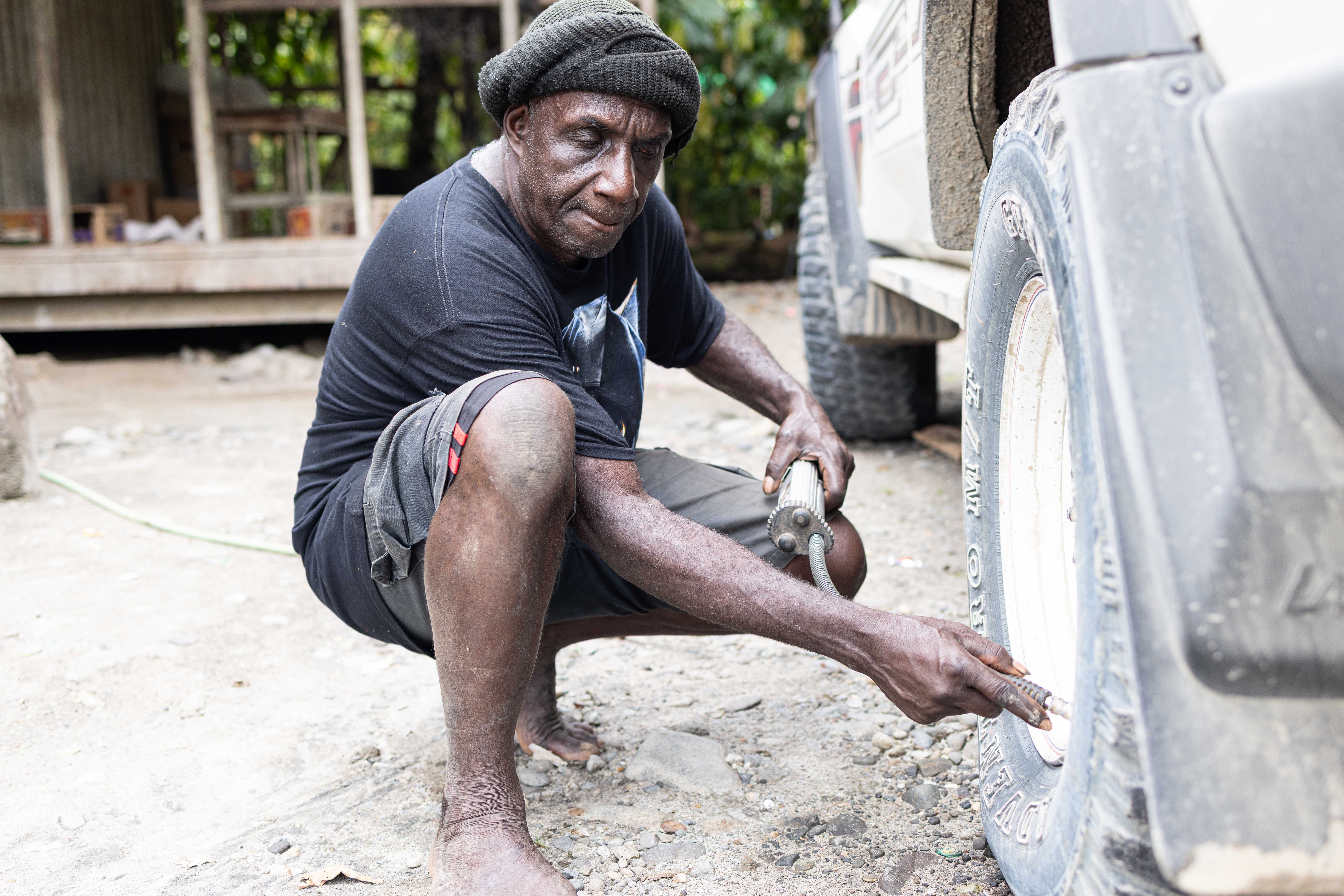 Sam serving a customer giving air pressure to the tyre