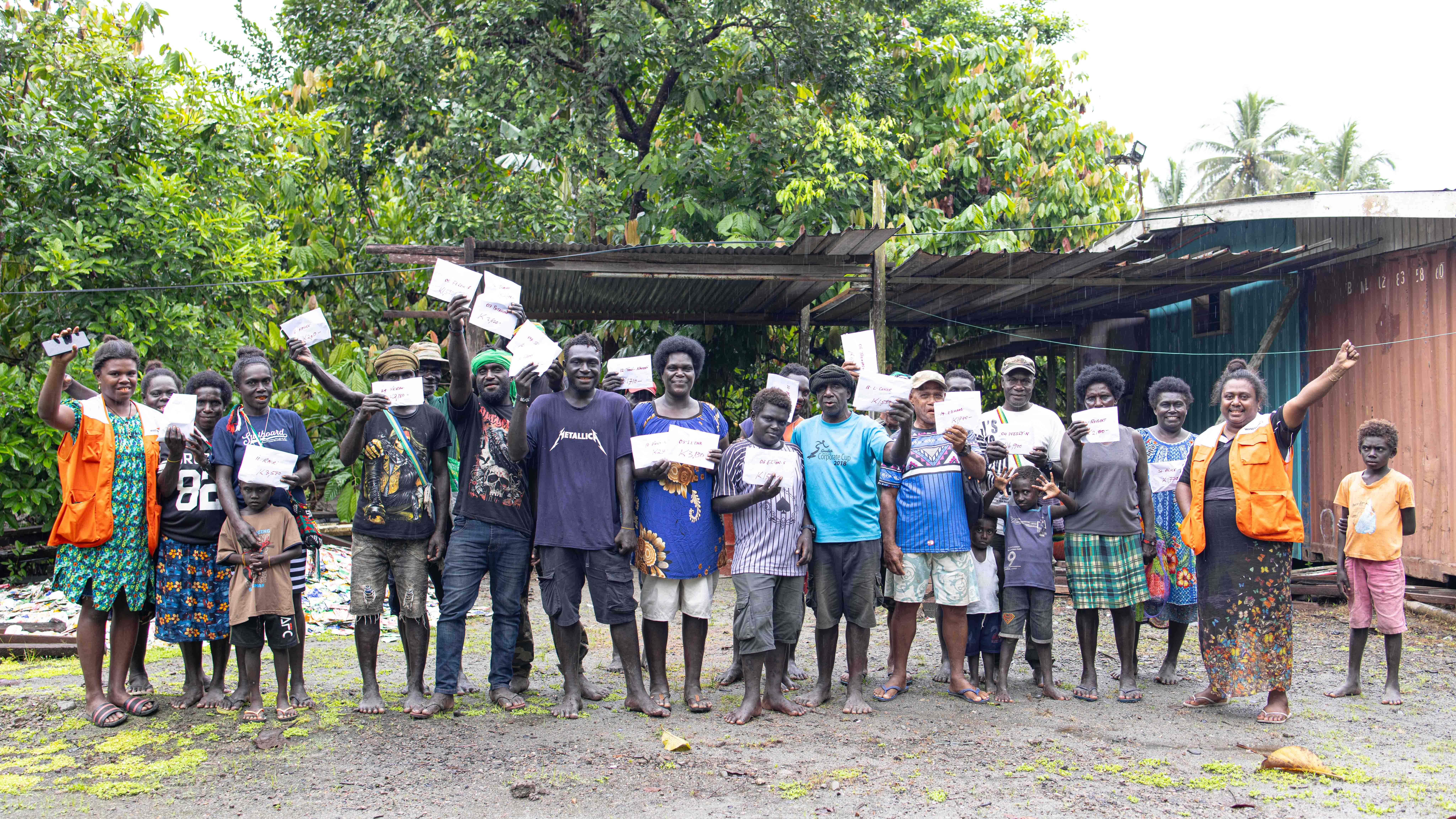 Members of the savings group posing for a group photo after receiving their shares.
