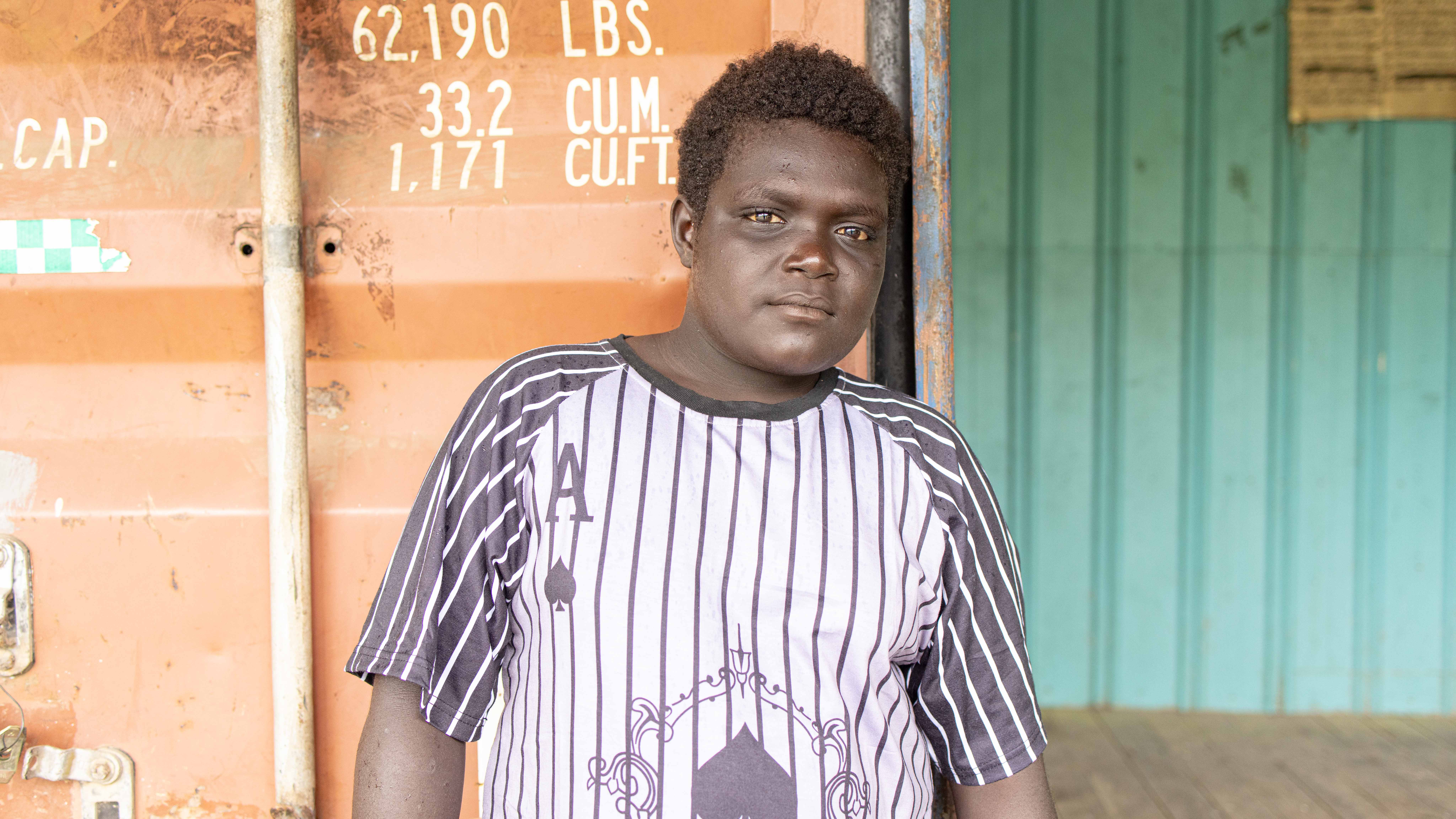 Elton, the youngest member of the savings group and Sam’s last-born son.