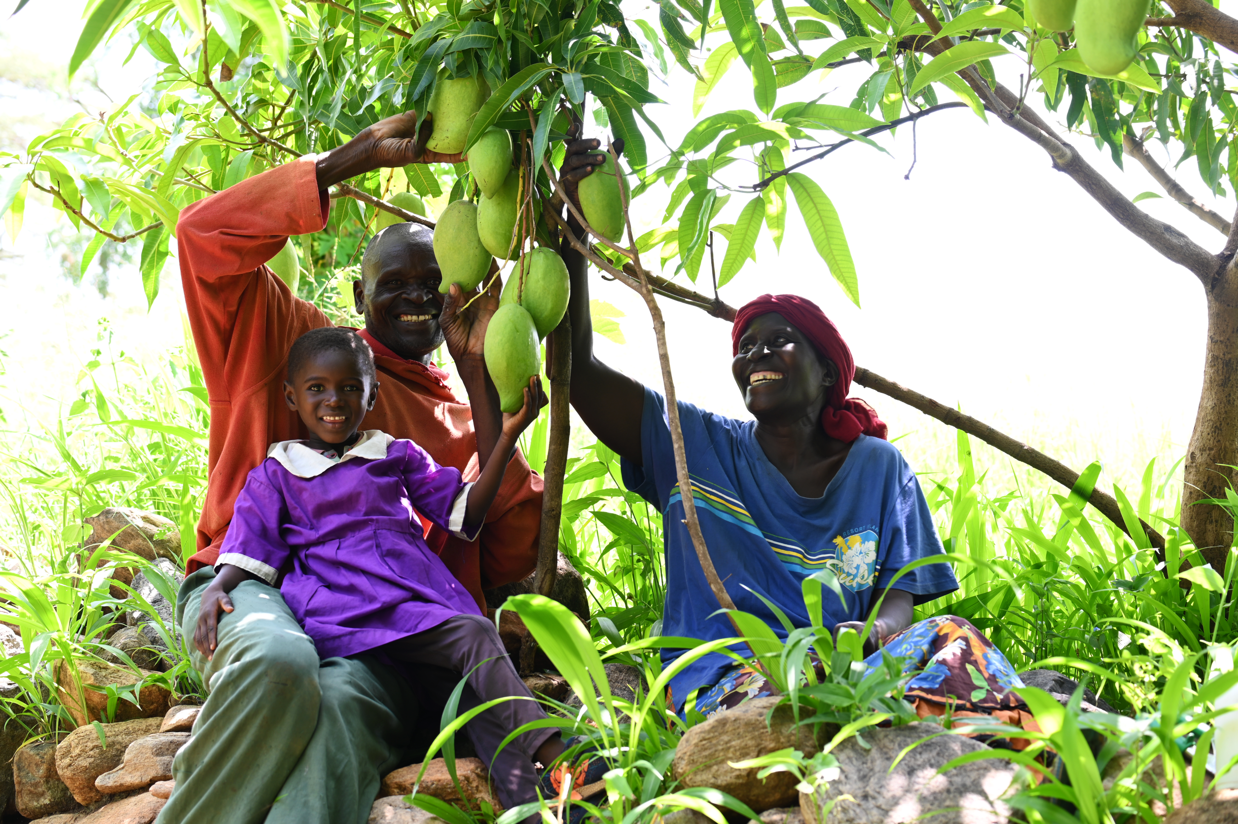 Blessing in the company of her grandparents, Joyce and Edward after coming from school.©World Vision Photo/ Hellen Owuor