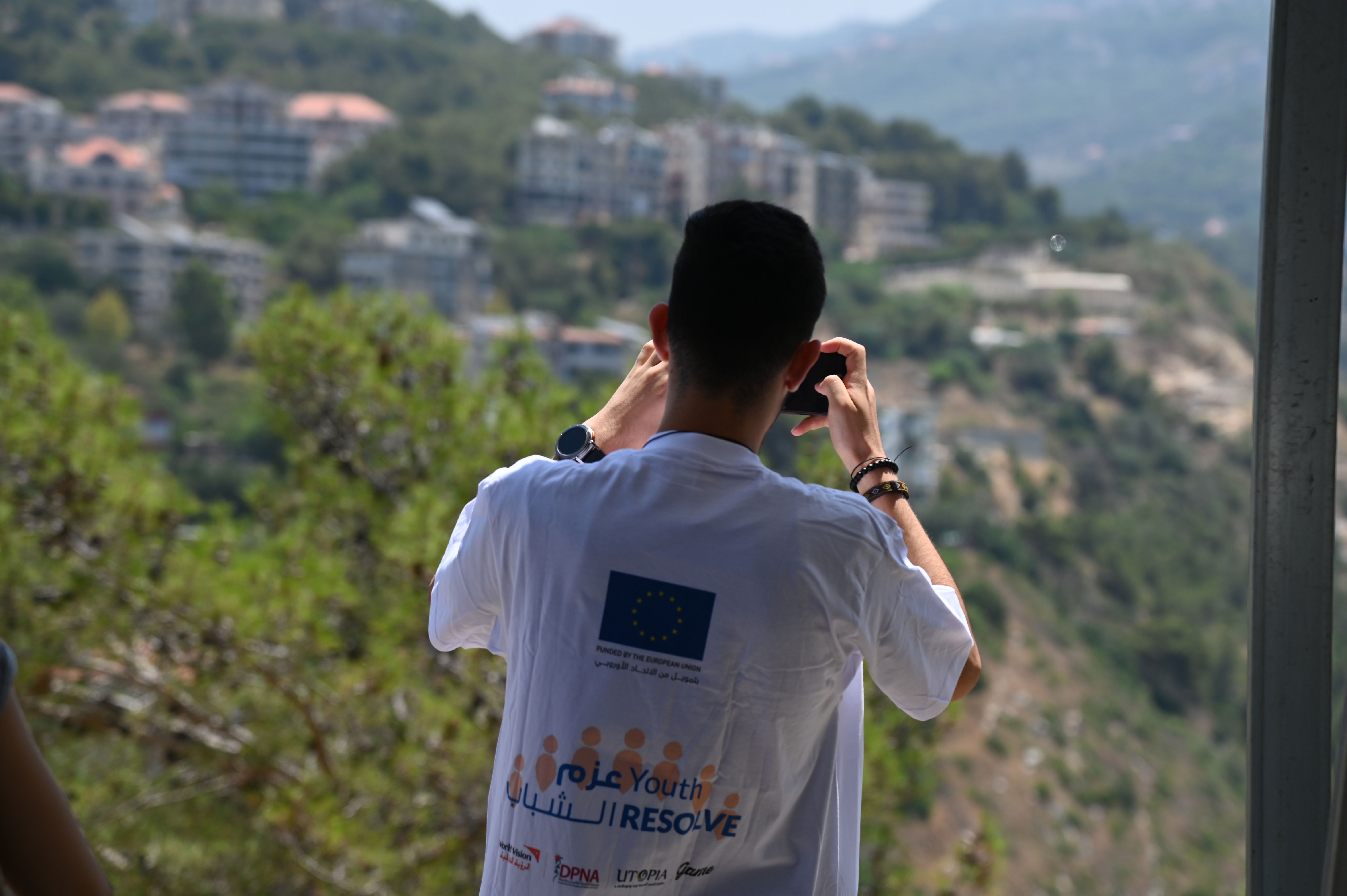 Louay taking pictures for his city
