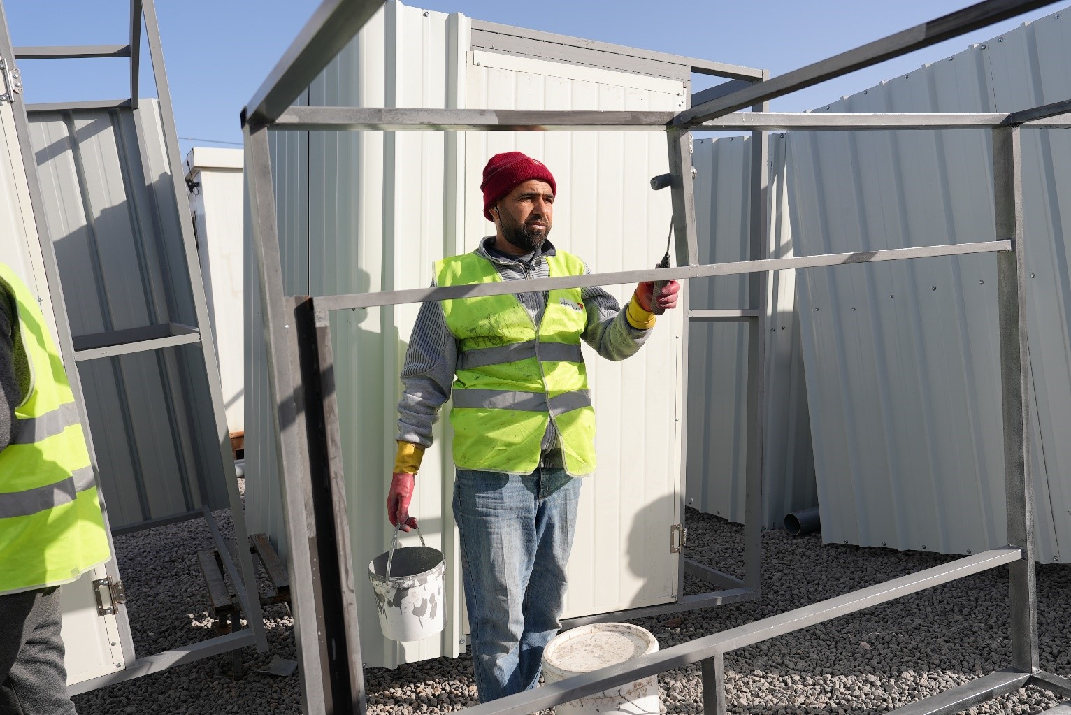 Abdullah* working in his profession as a painter