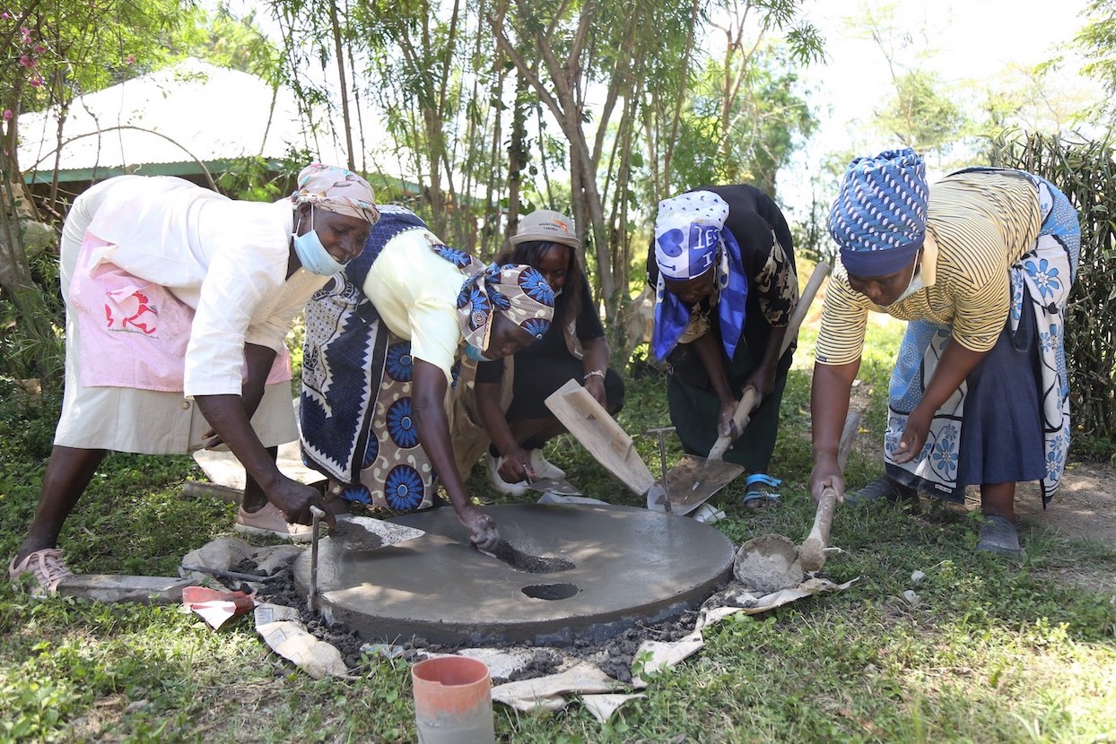 Tha Kosano CLTS group making the SanPlat concrete slab. World Vision trained them on  the technology. 