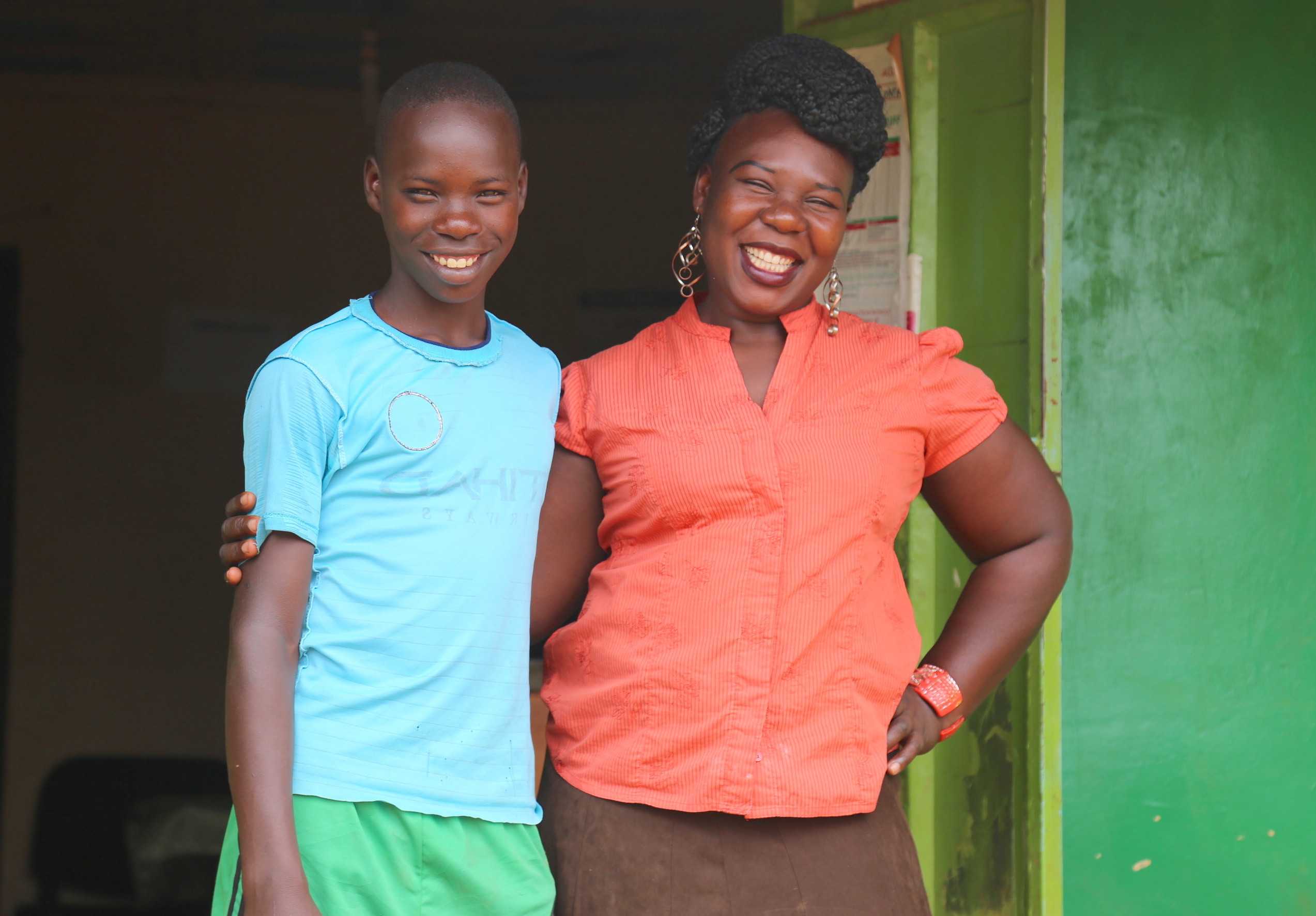 Raphael with his mother Margaret. She is proud of the good work that her son does in their community.