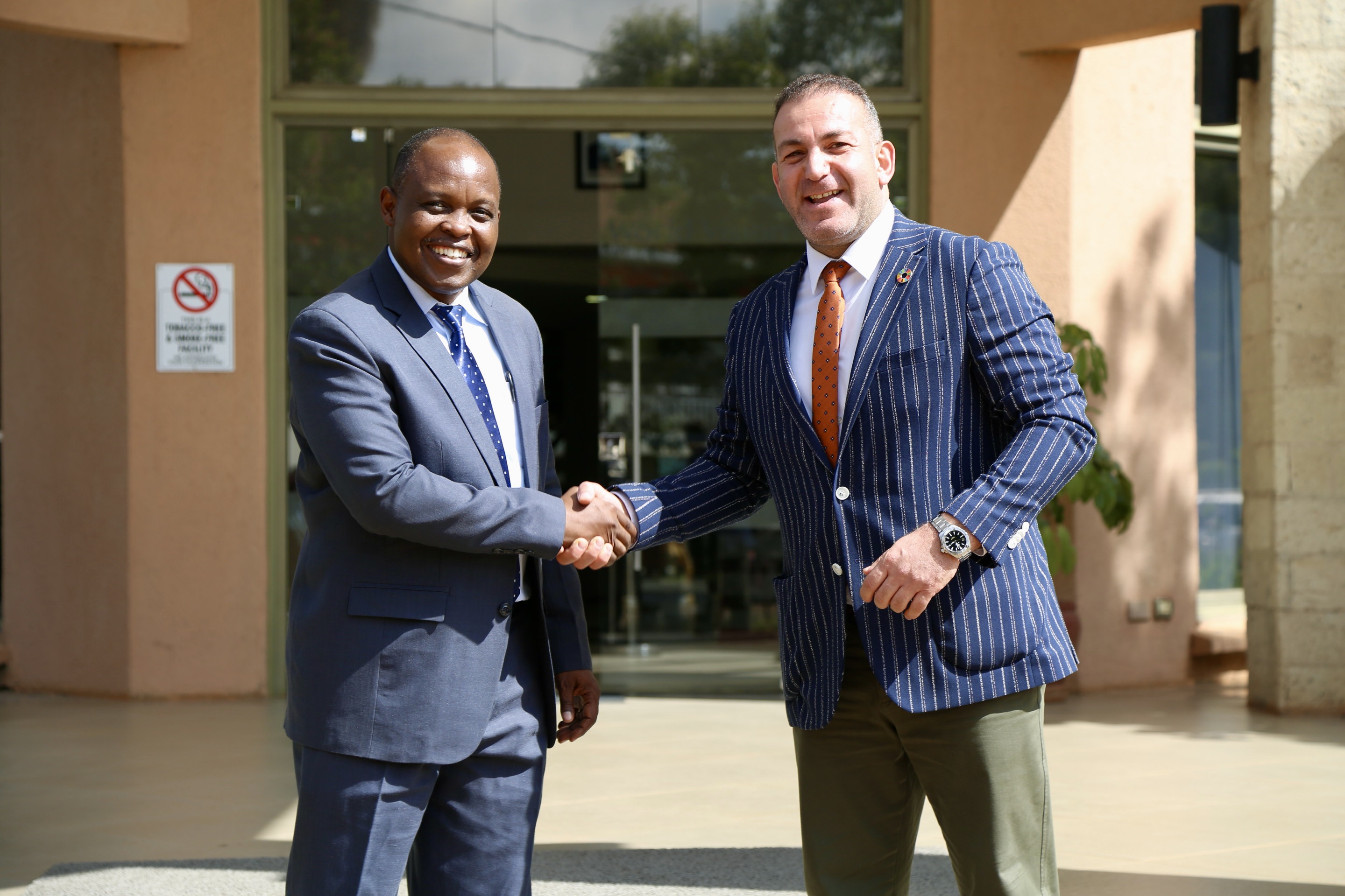 WVK Acting National Director with the IOM Deputy Chief of Mission at the World Vision Kenya office.JPG