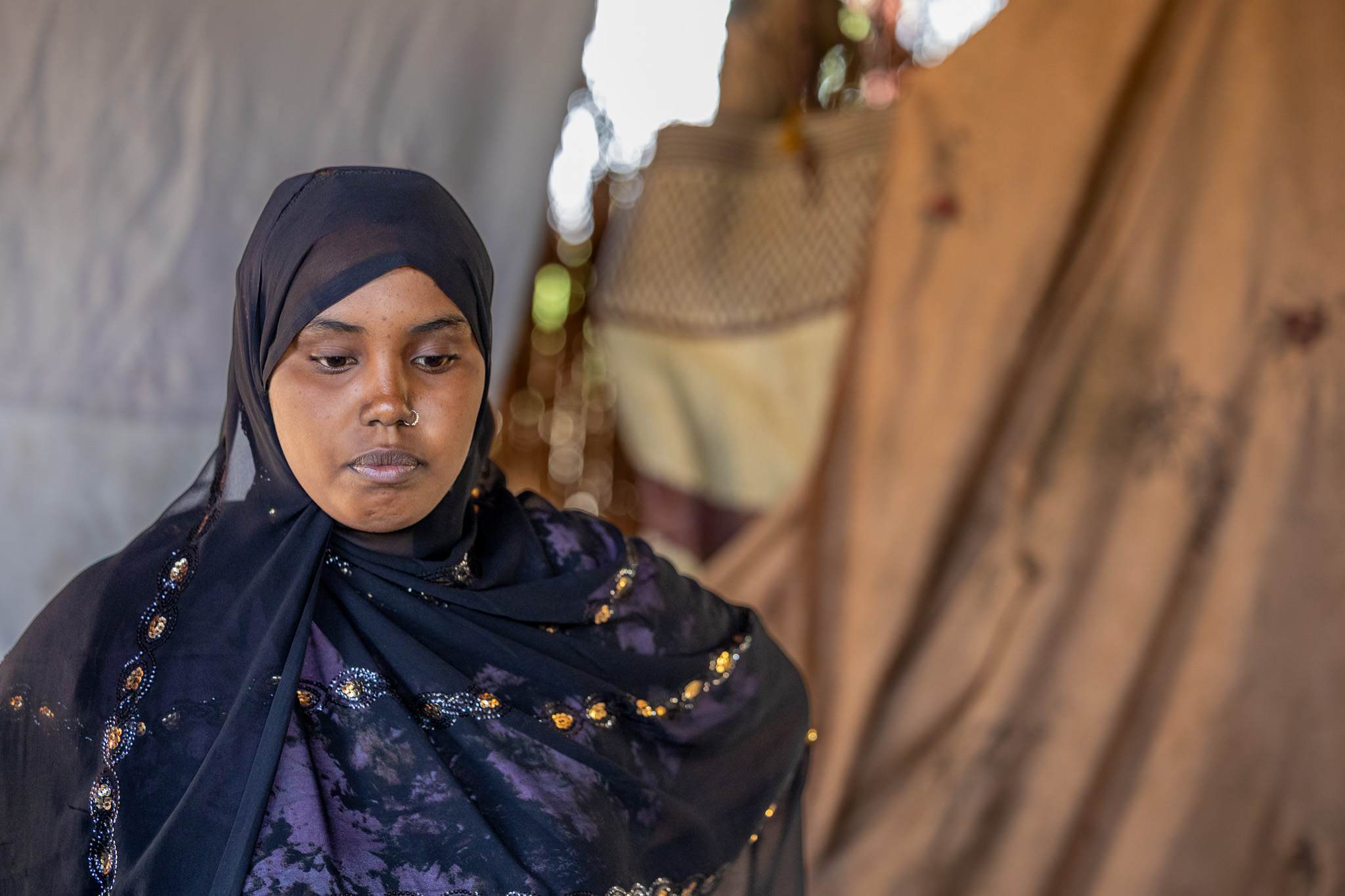 Marwa Farhan Mohamed, 15, sits quietly in the shade of what remains of her family’s home in rural Somalia. Her voice reflects the innocence of a child, but it is also heavy with despair.