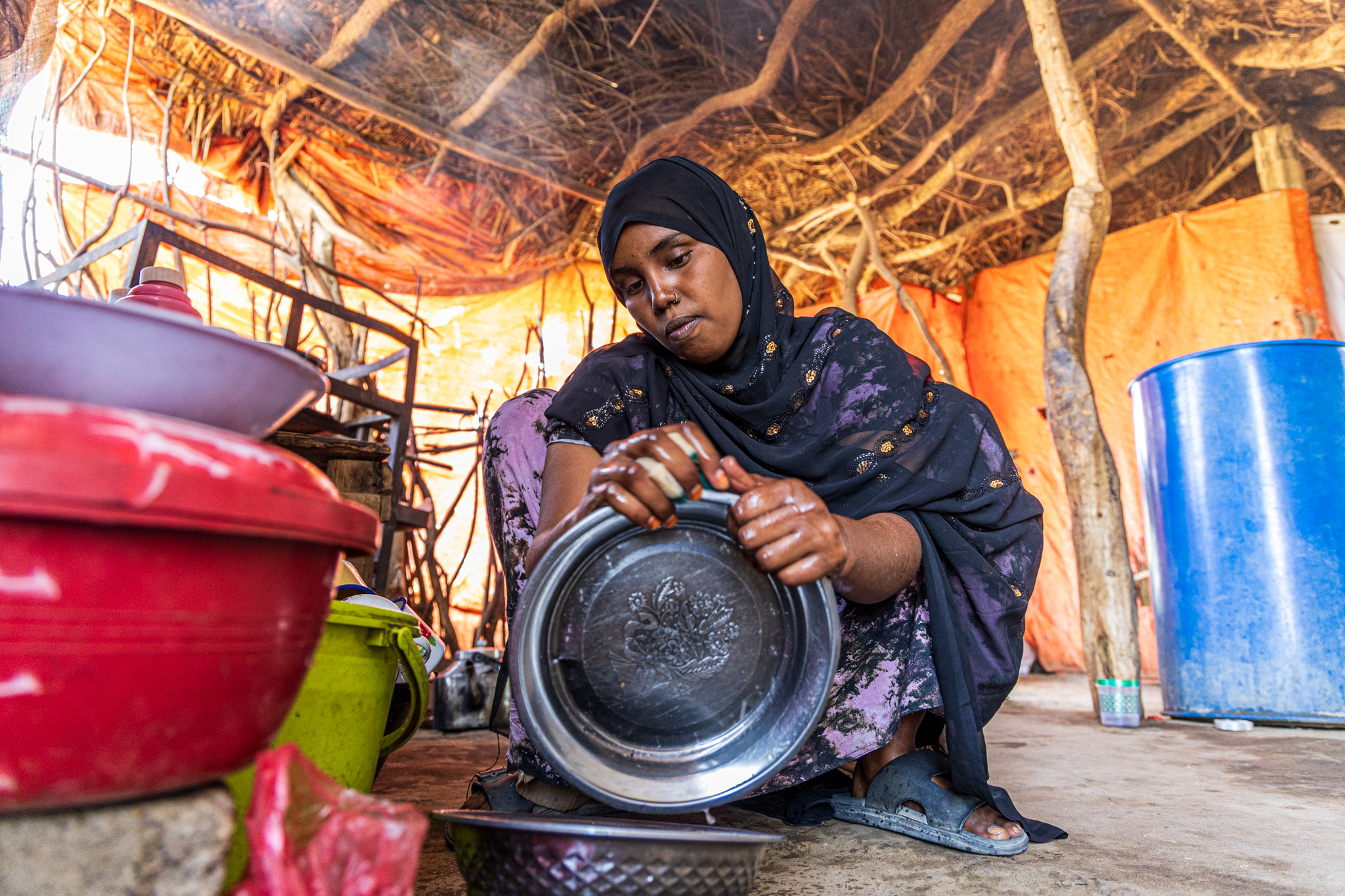 Marwa Farhan Mohamed, 15, doing chores at her family’s home in rural Somalia.