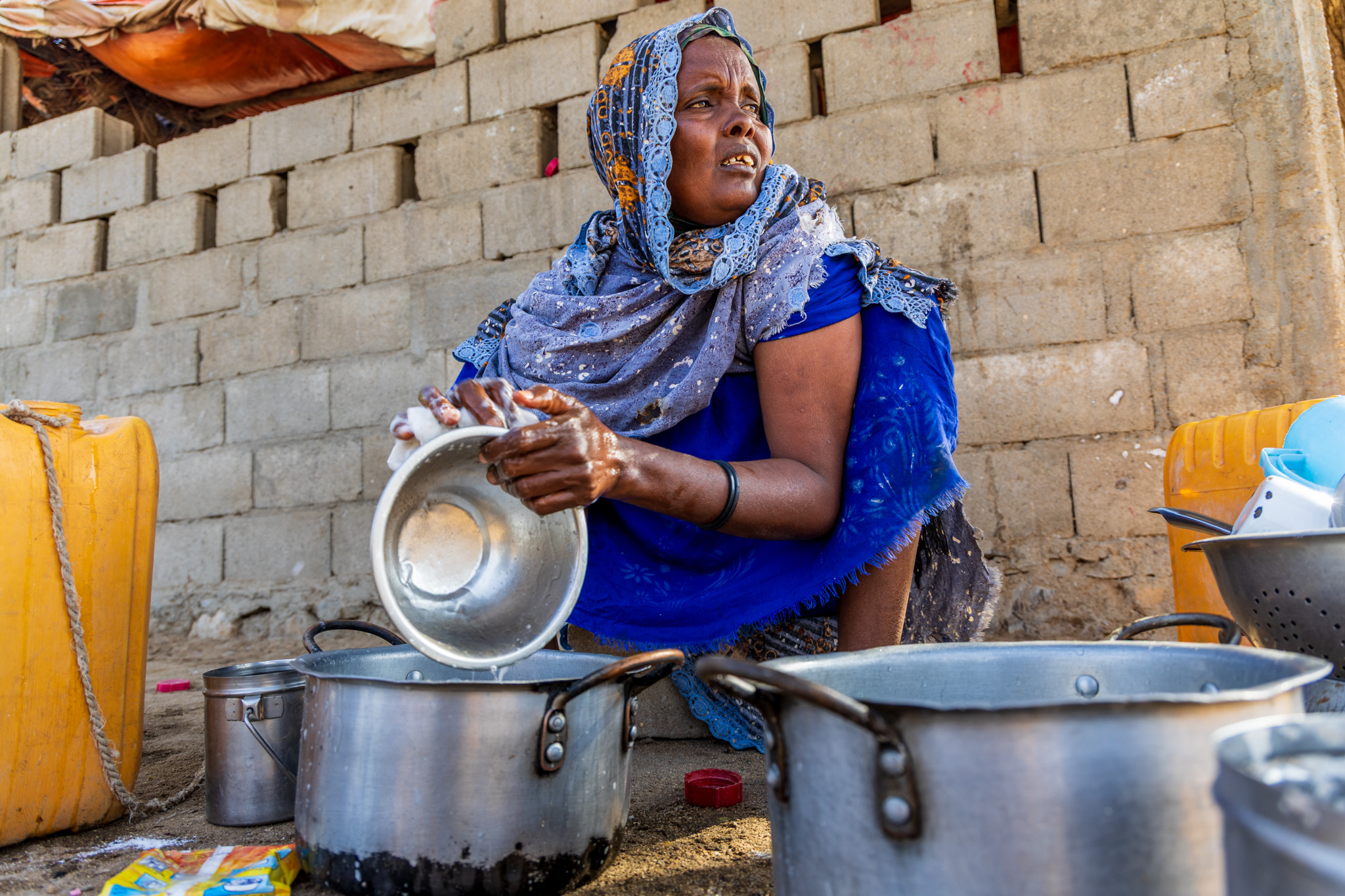 Ayan carries out daily chores at her homestead with the help of her children. Her elder daughters prepares the donkey to fetch water from a distant source. After a long journey, they return with water for the household.