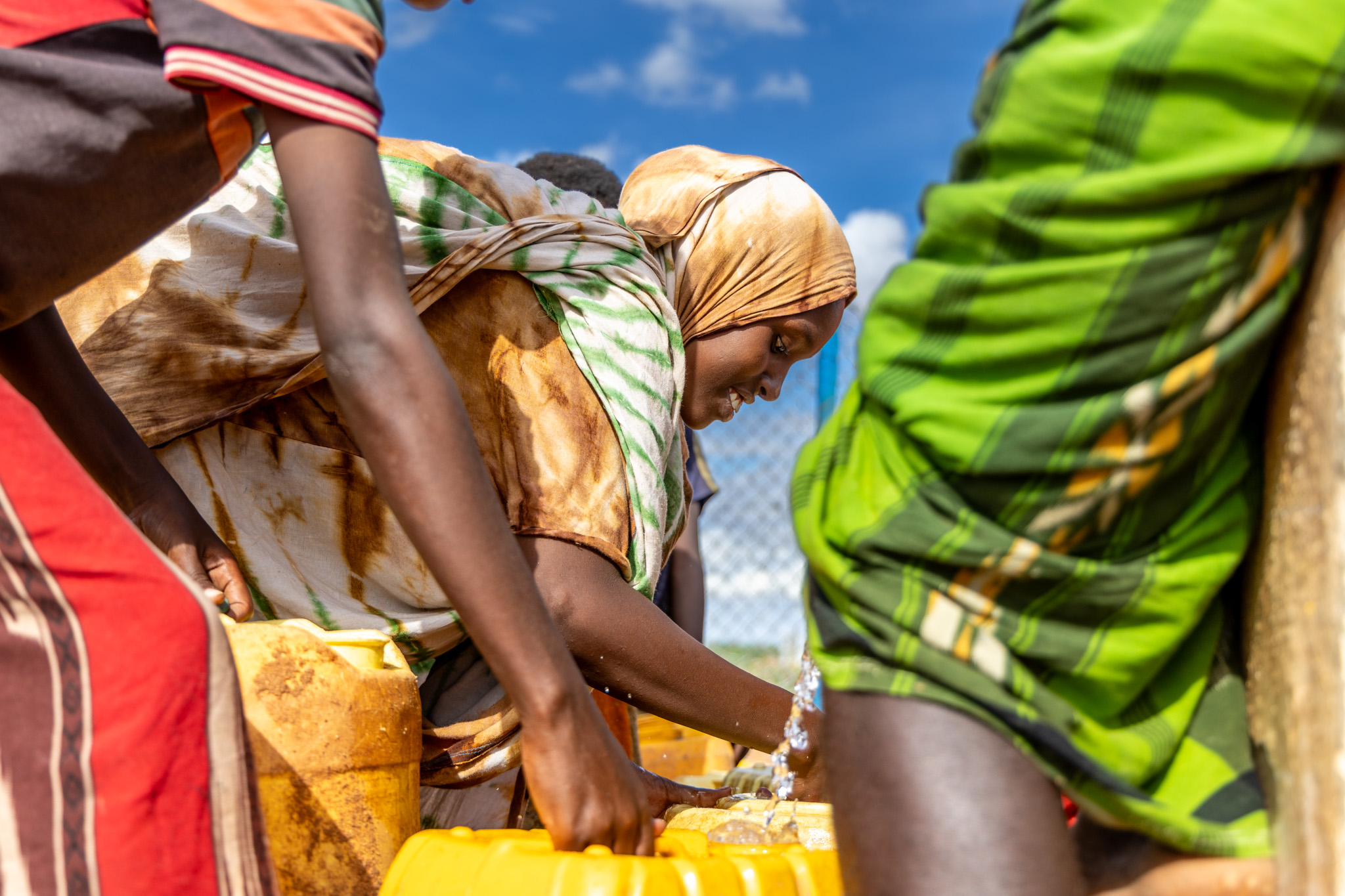 Muslimo walks the dusty path to fetch water — a daily journey of strength and responsibility carried by a 15-year-old girl with the weight of her family on her shoulders.