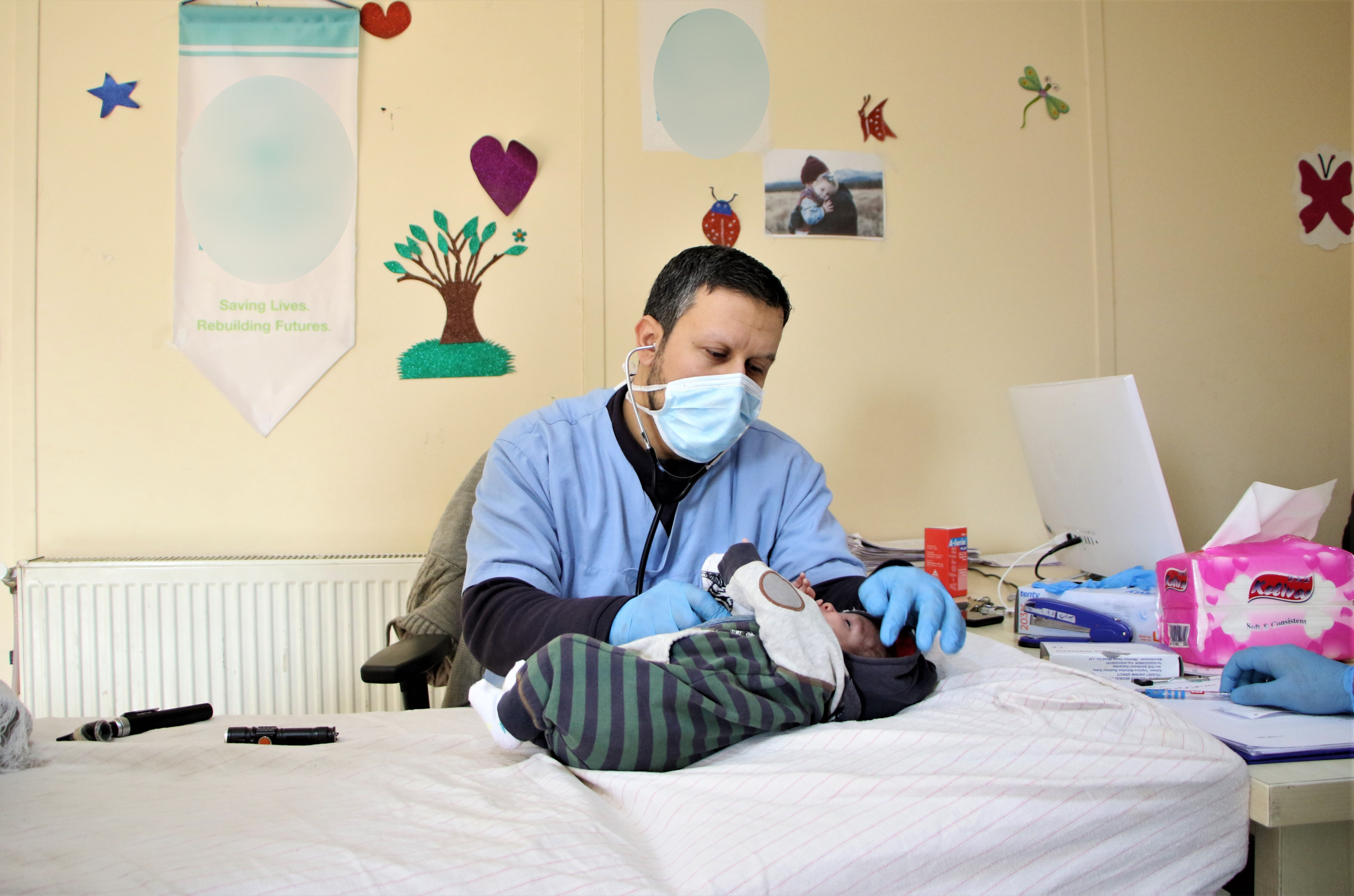 An infant under medical examination at the paediatrics’ clinic.