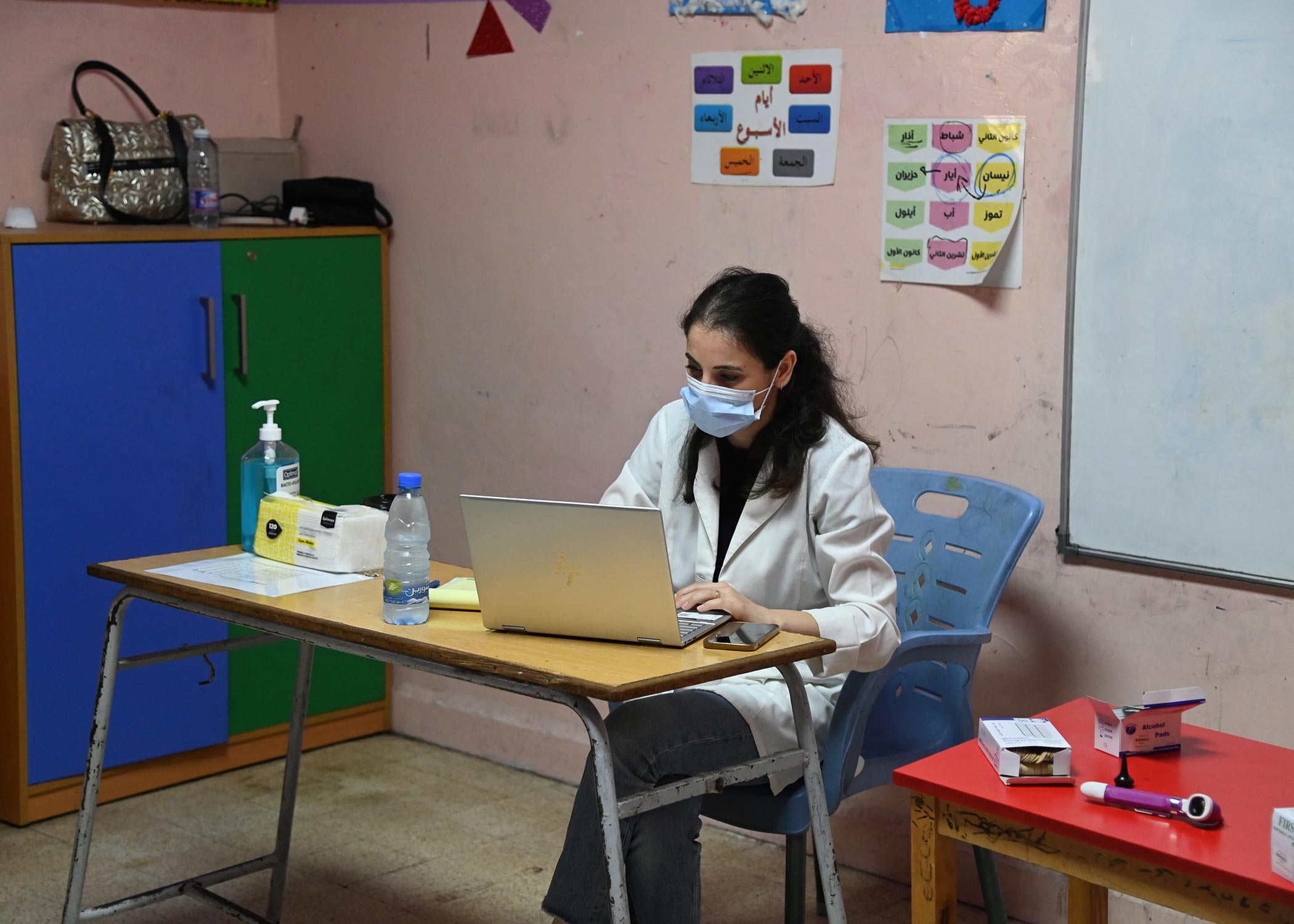 Doctor Rola on her desk in a classroom