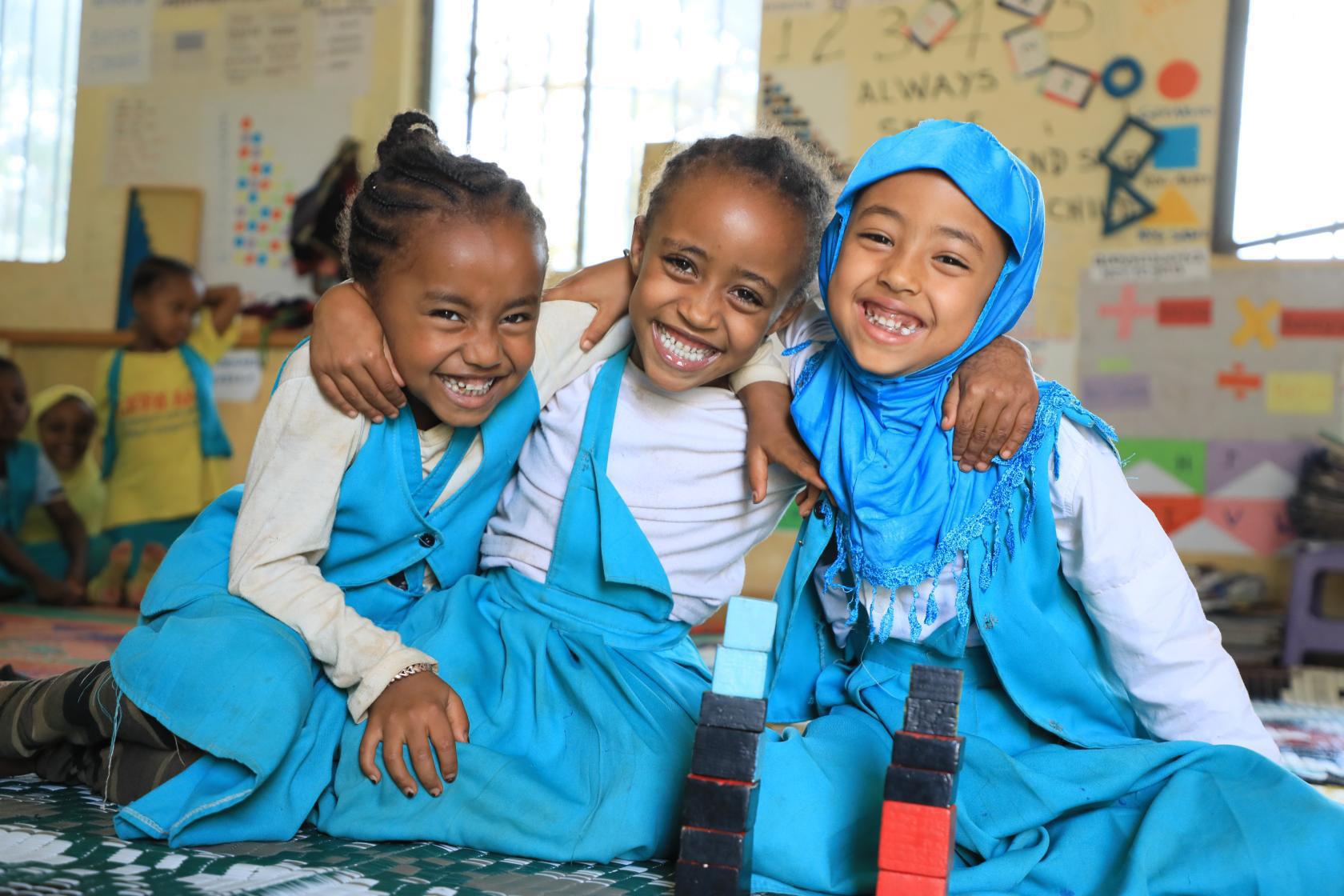 Eilham and her friends smiling