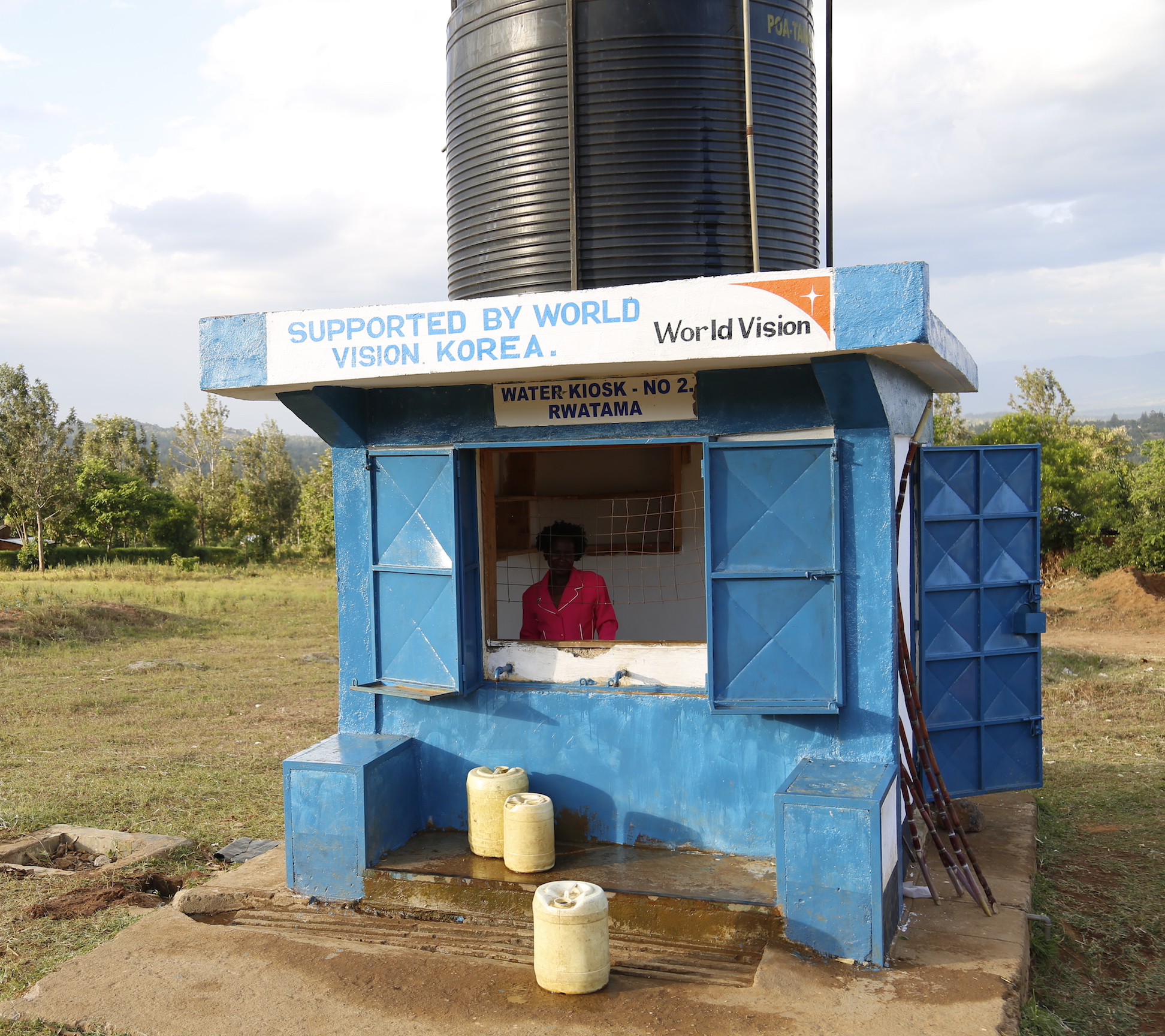 Mary at the water kiosk built by World Vision in Angurai, Western Kenya. © World Vision/Photo by Susan Otieno