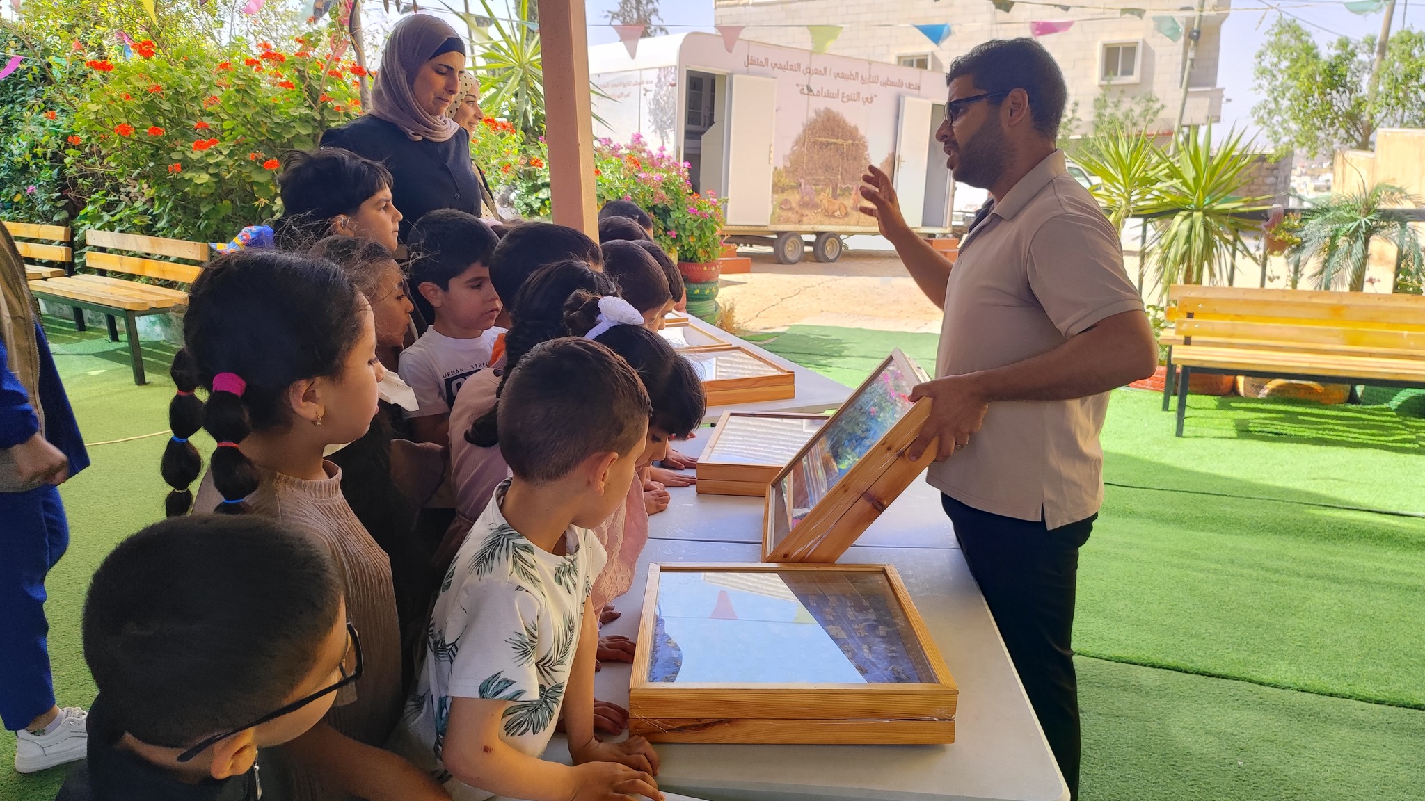 Children learn about local biodiversity through a mobile museum tour.
