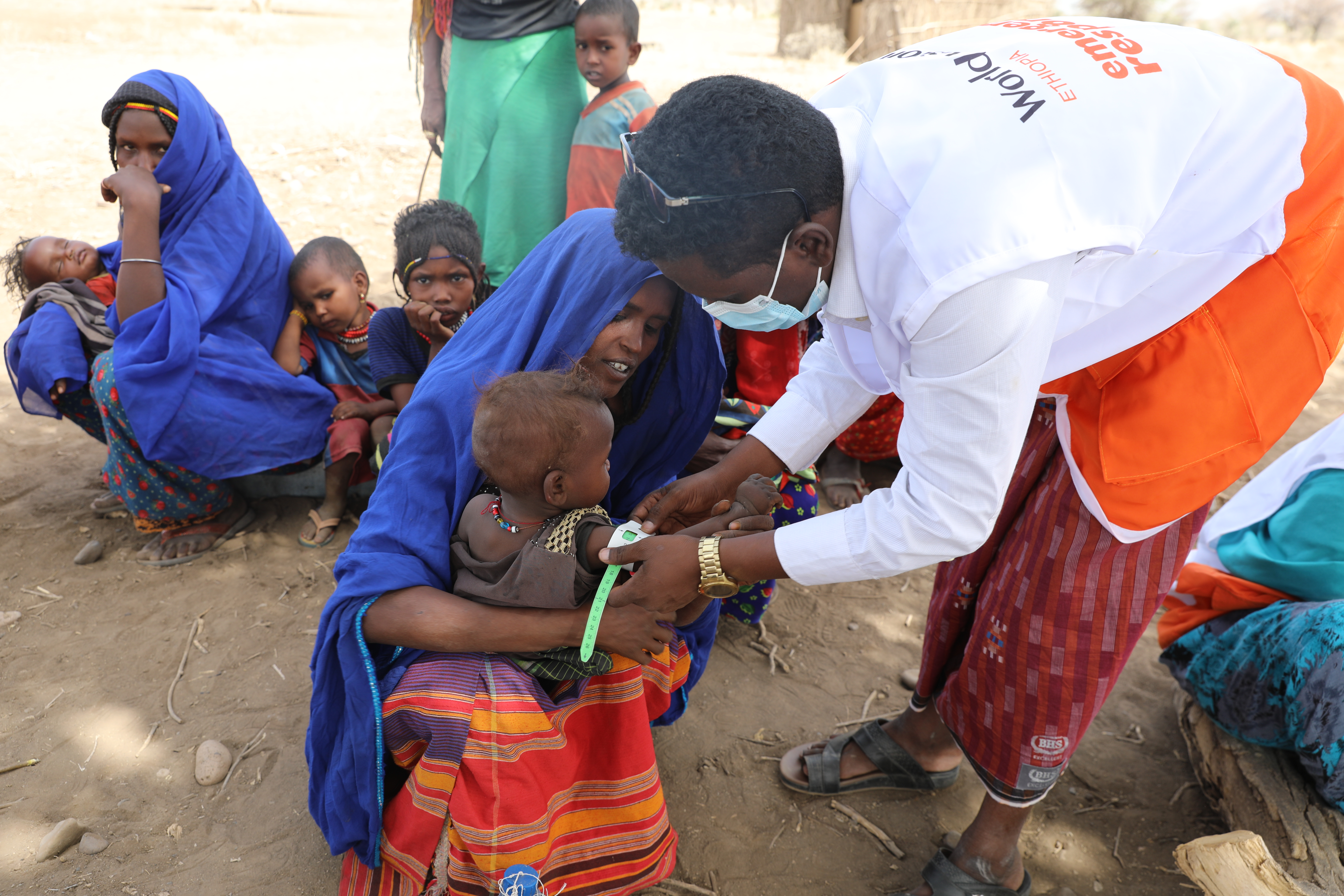 World Vision staff giving mobile health service