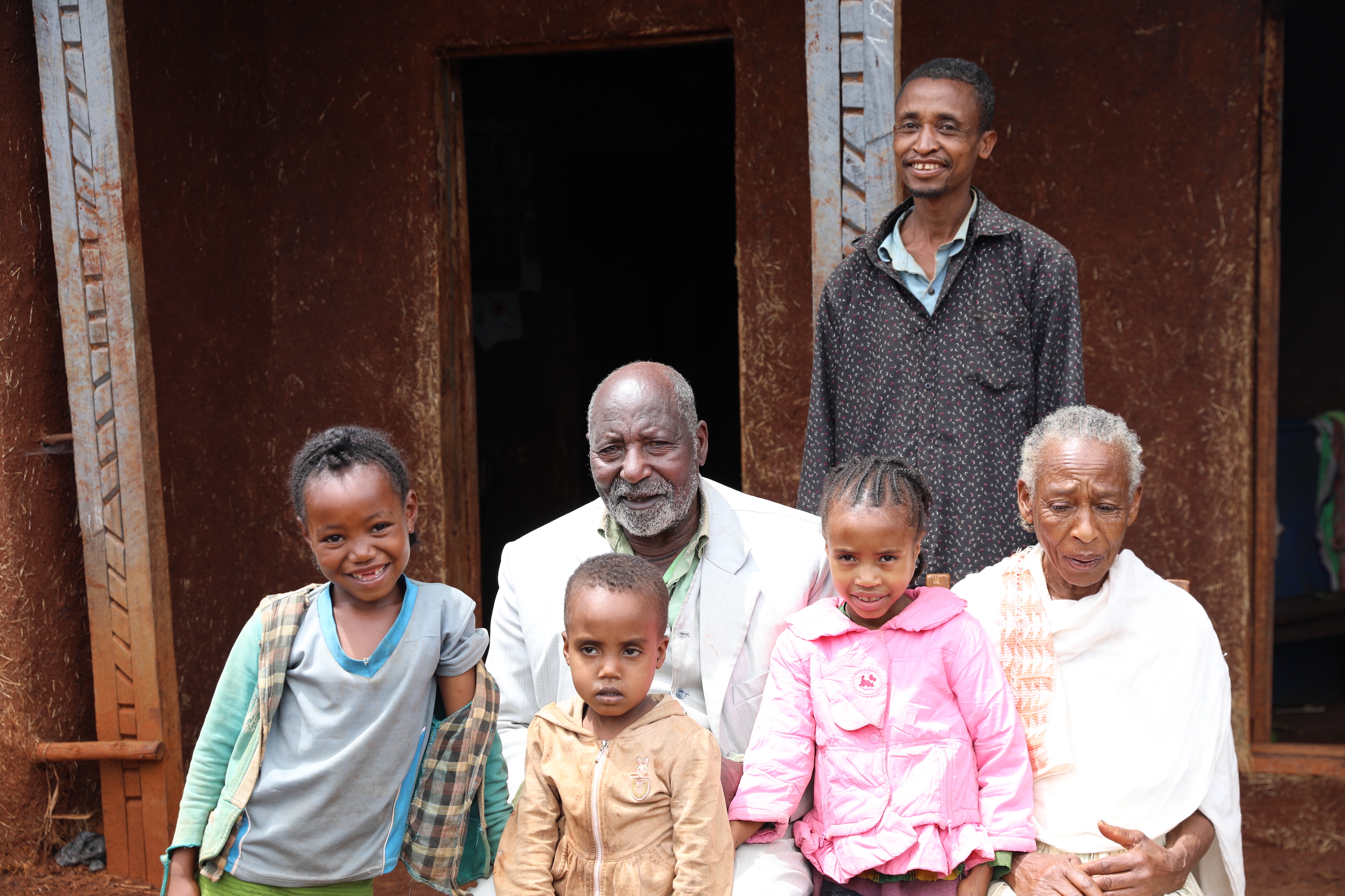 Jigs and his family at his new house