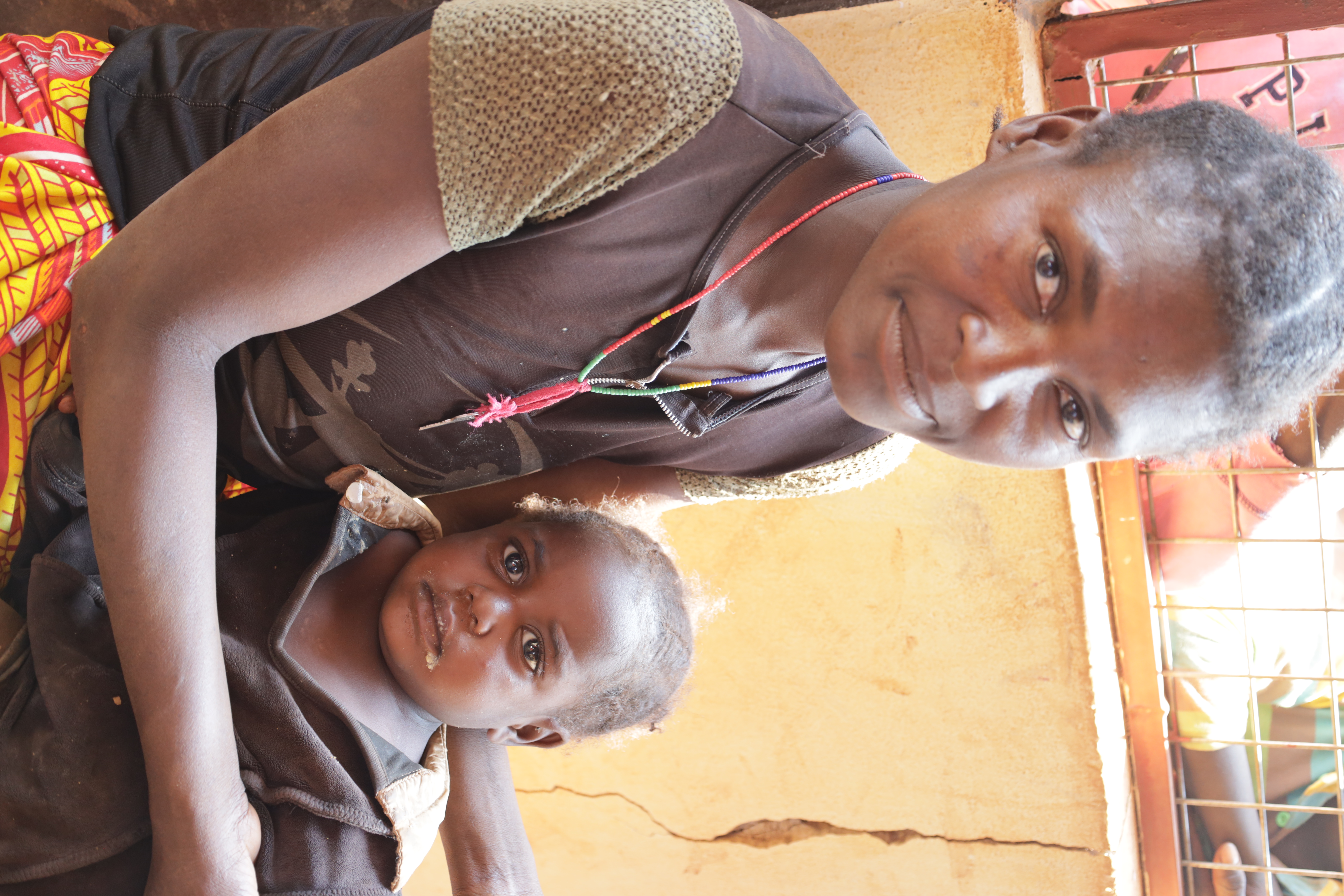 Carolina holding her daughter who is recovering from malnutrition