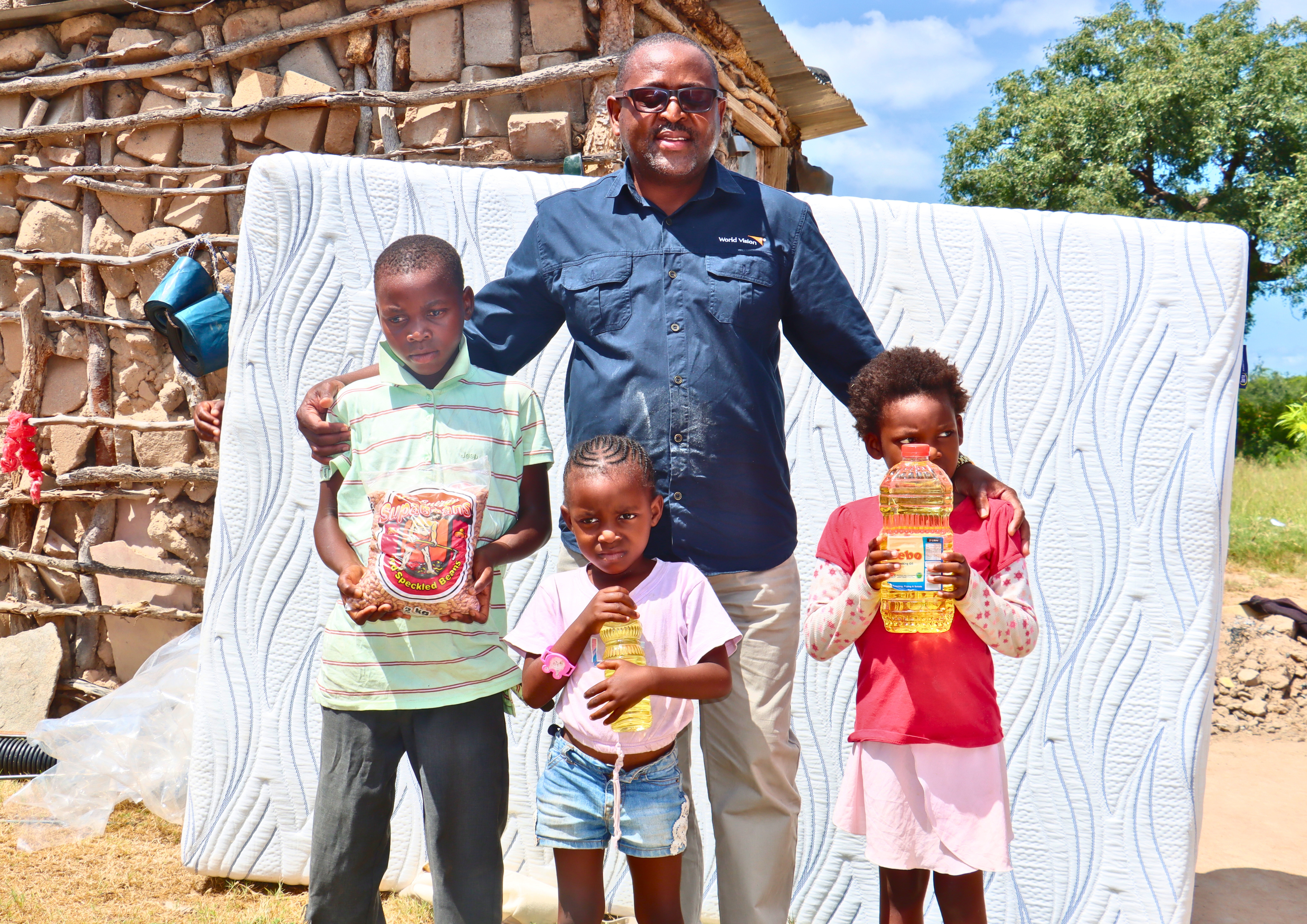 World Vision Eswatini National Director, Amos Zaindi during a visit to a family affected by floods in Eswatini. 