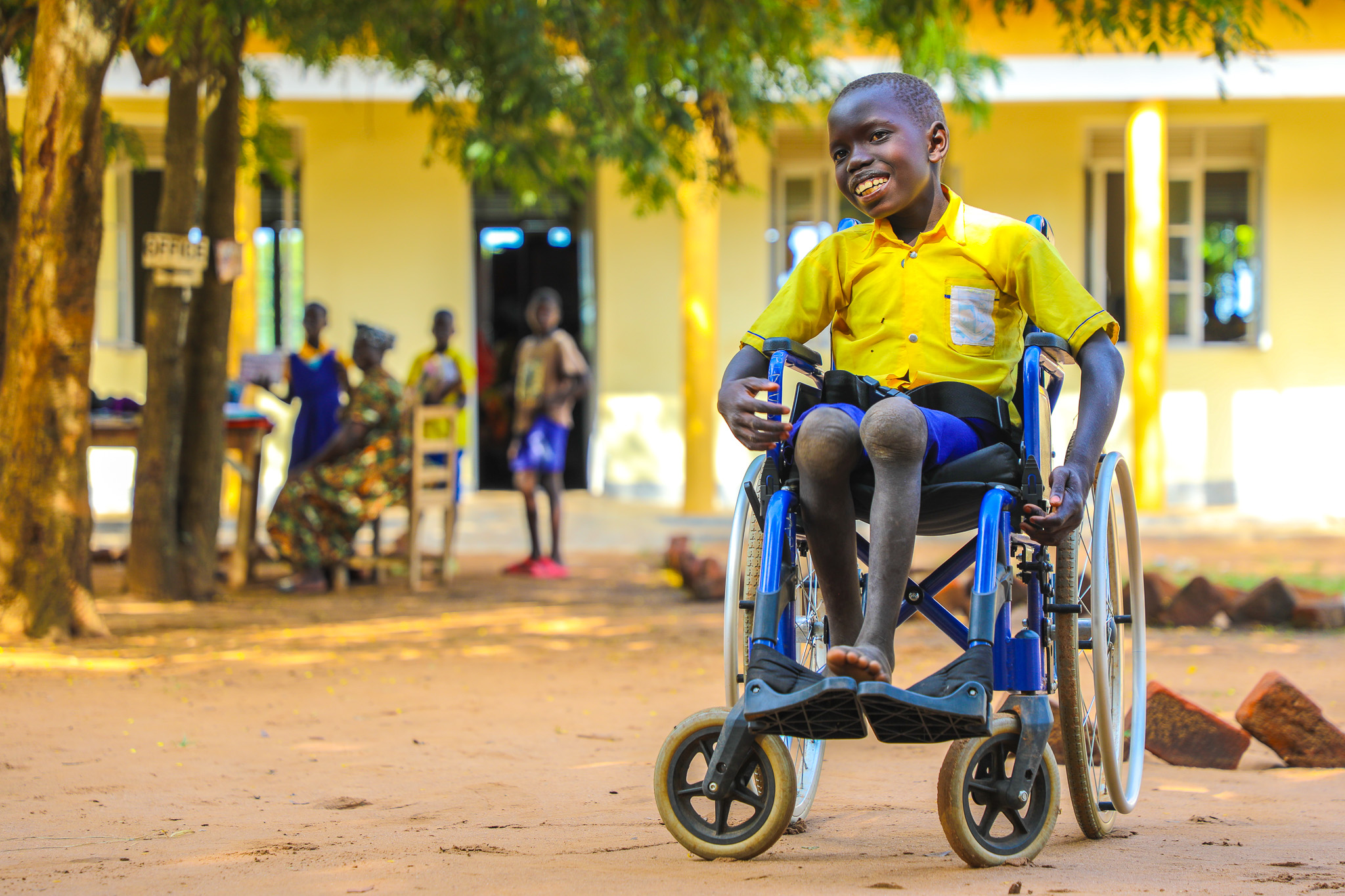 Lematia with his wheelchair on the school compound