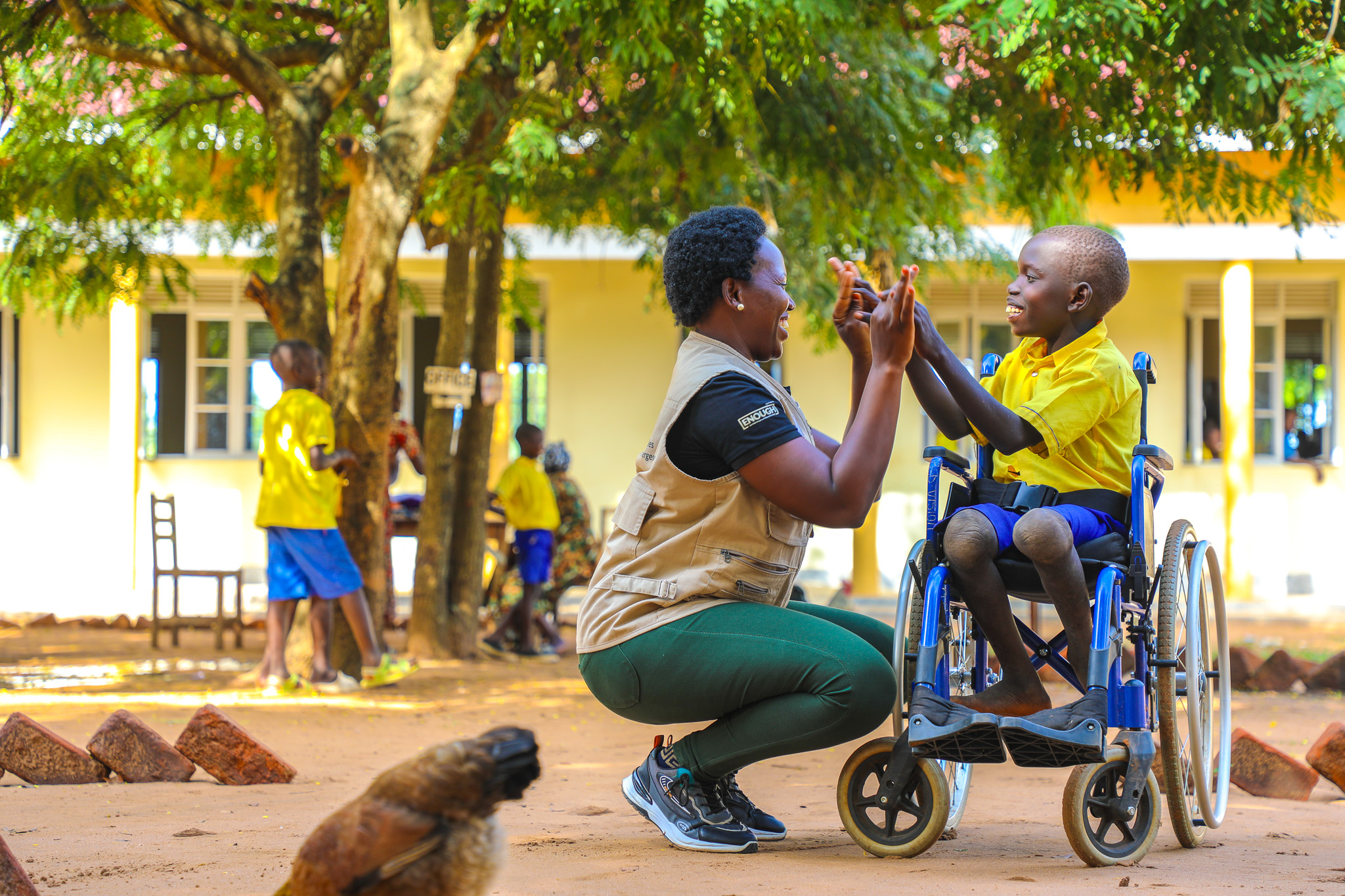 Lematia with a World Vision staff at his school.