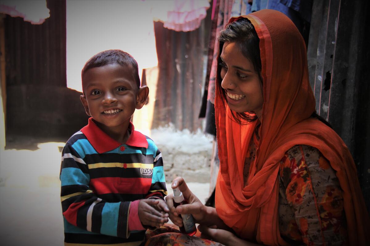 Child in Bangladesh with his mother