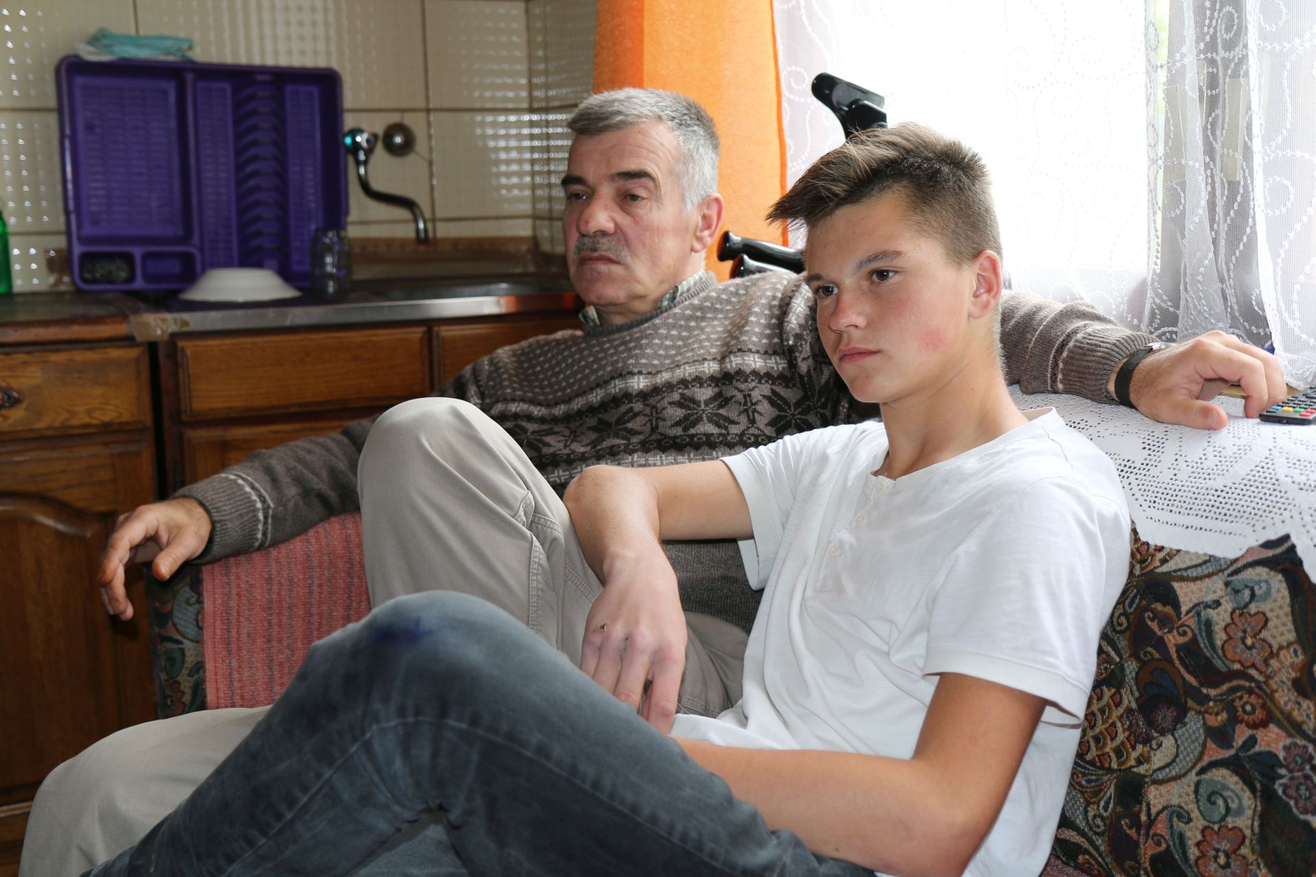 Afan, a landmine survivor, with his son Amar