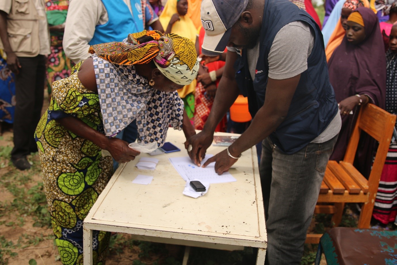 Ali registering the first beneficiaries