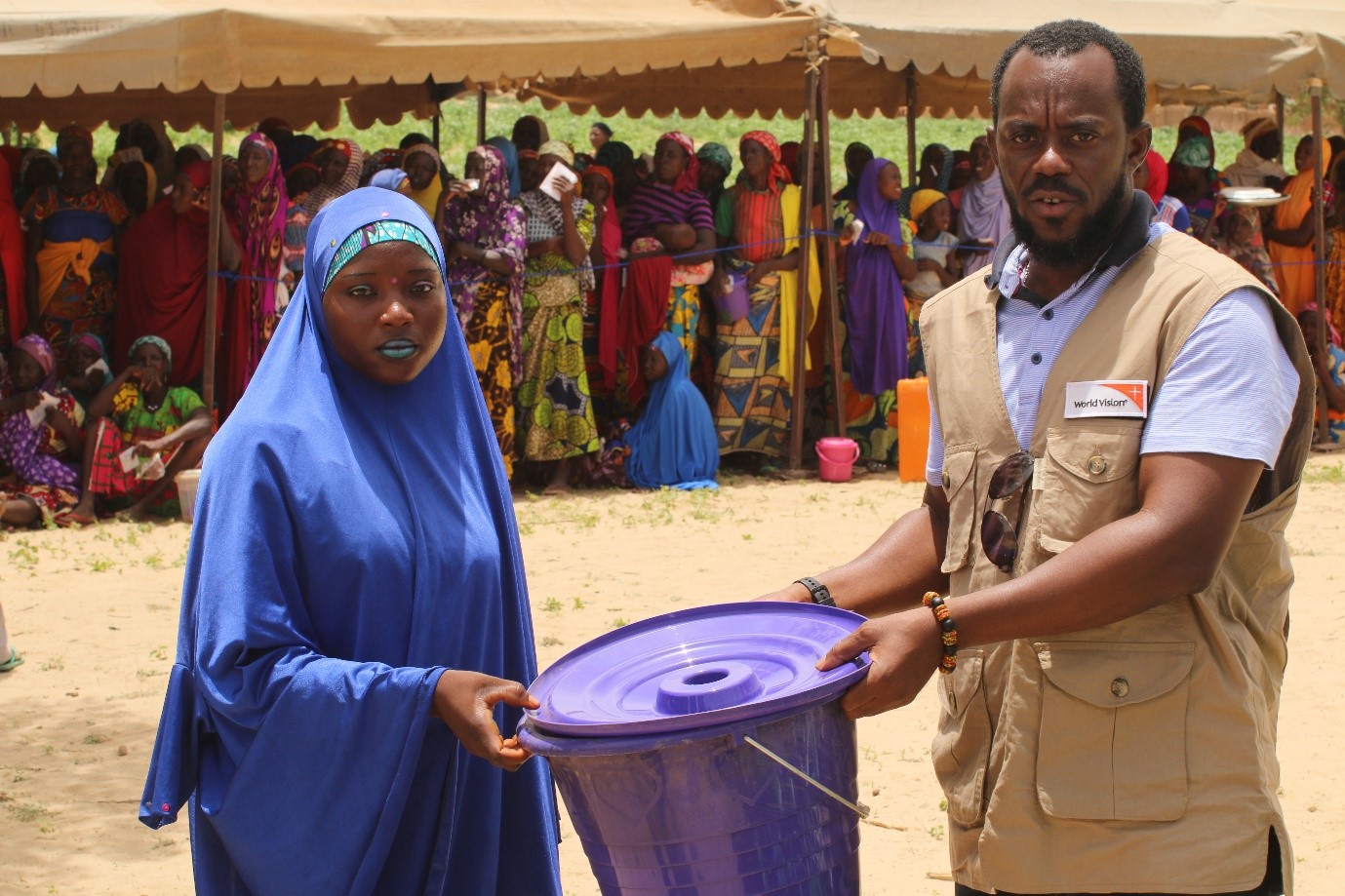 Amina receives her kit from Response Manager