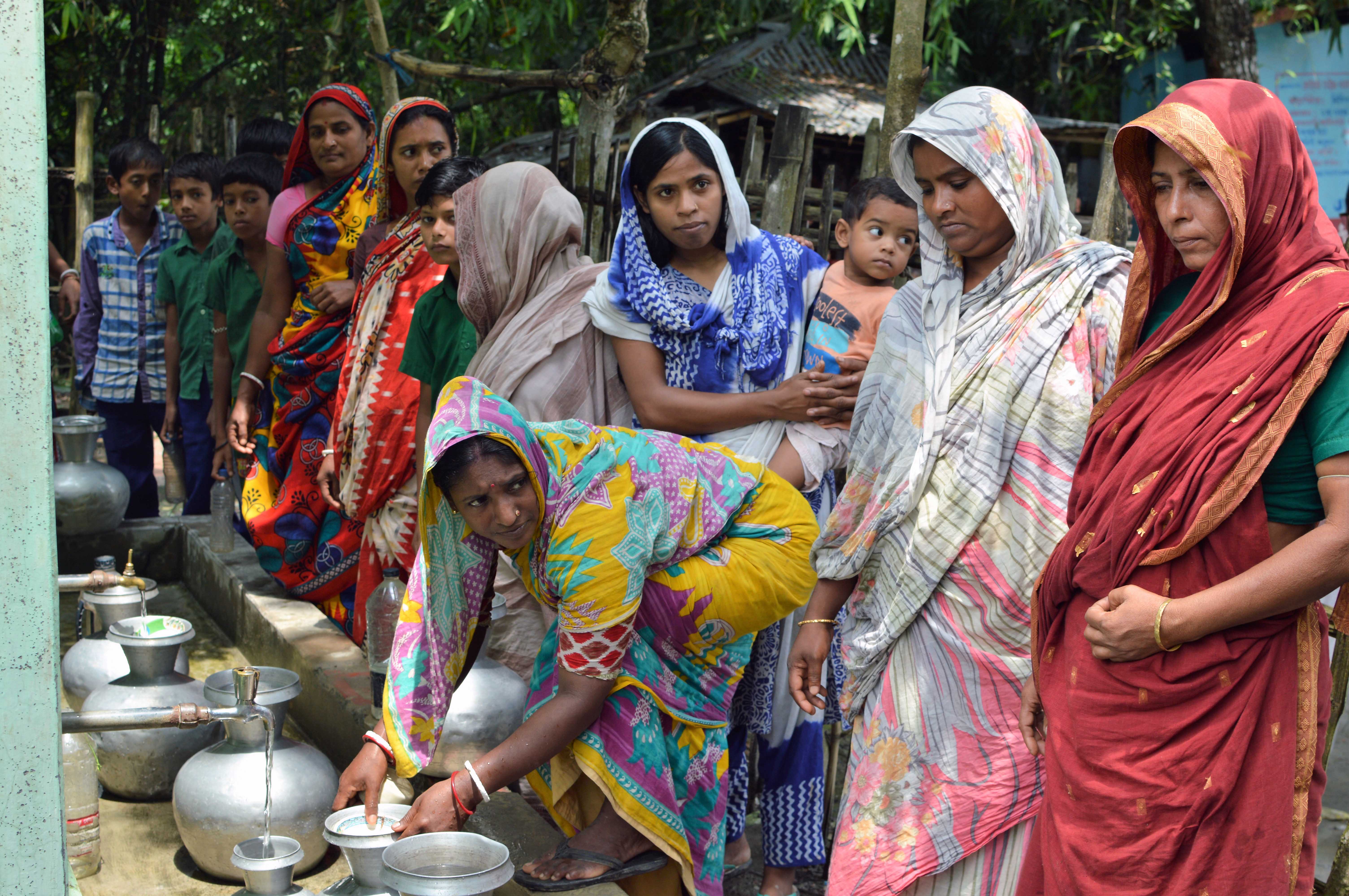 Gita Biswas and her neighbouring are collecting water from PSFs