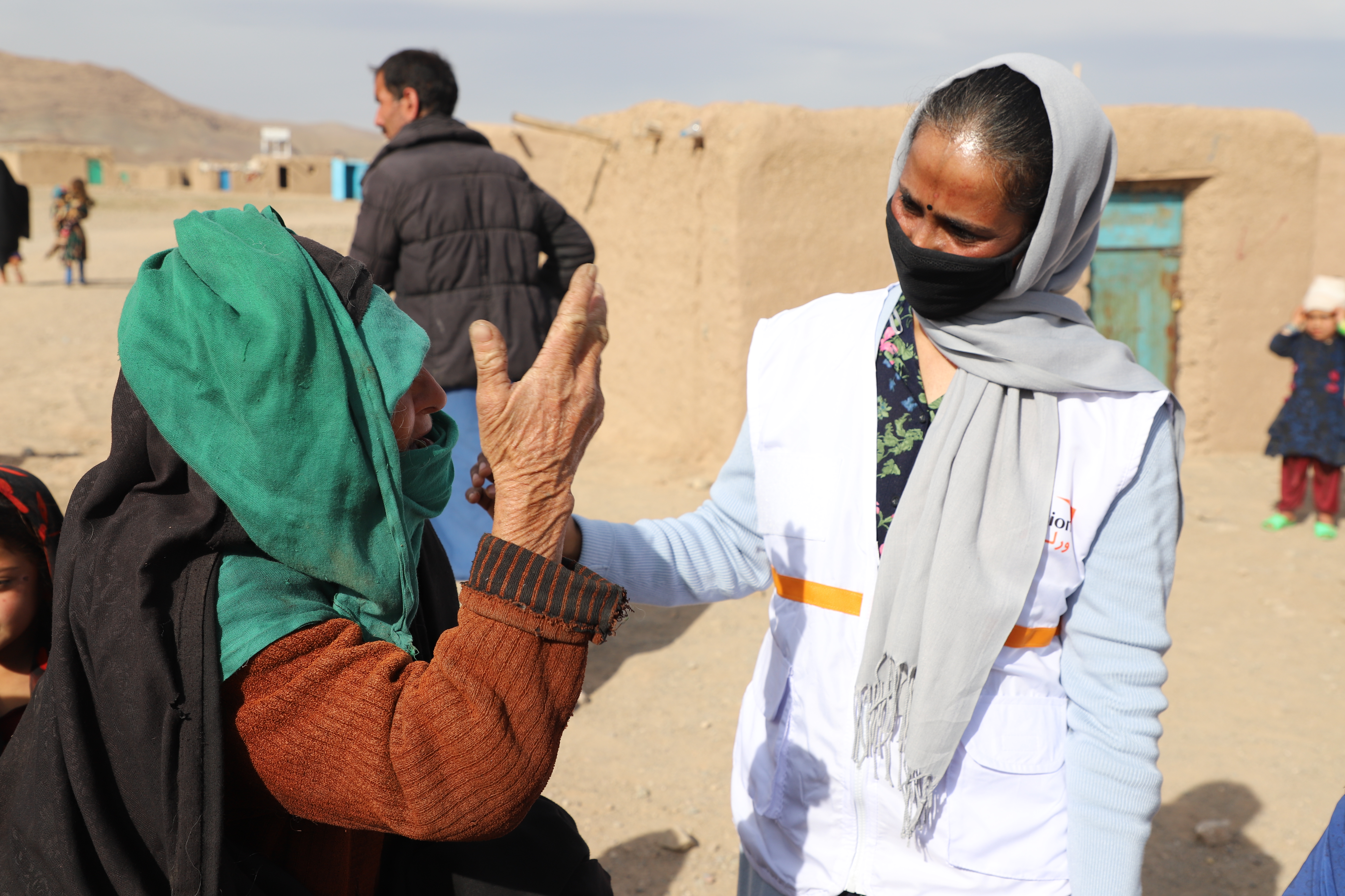 Asuntha Charles national director of World Vision's programmes in Afghanistan speaks with a woman