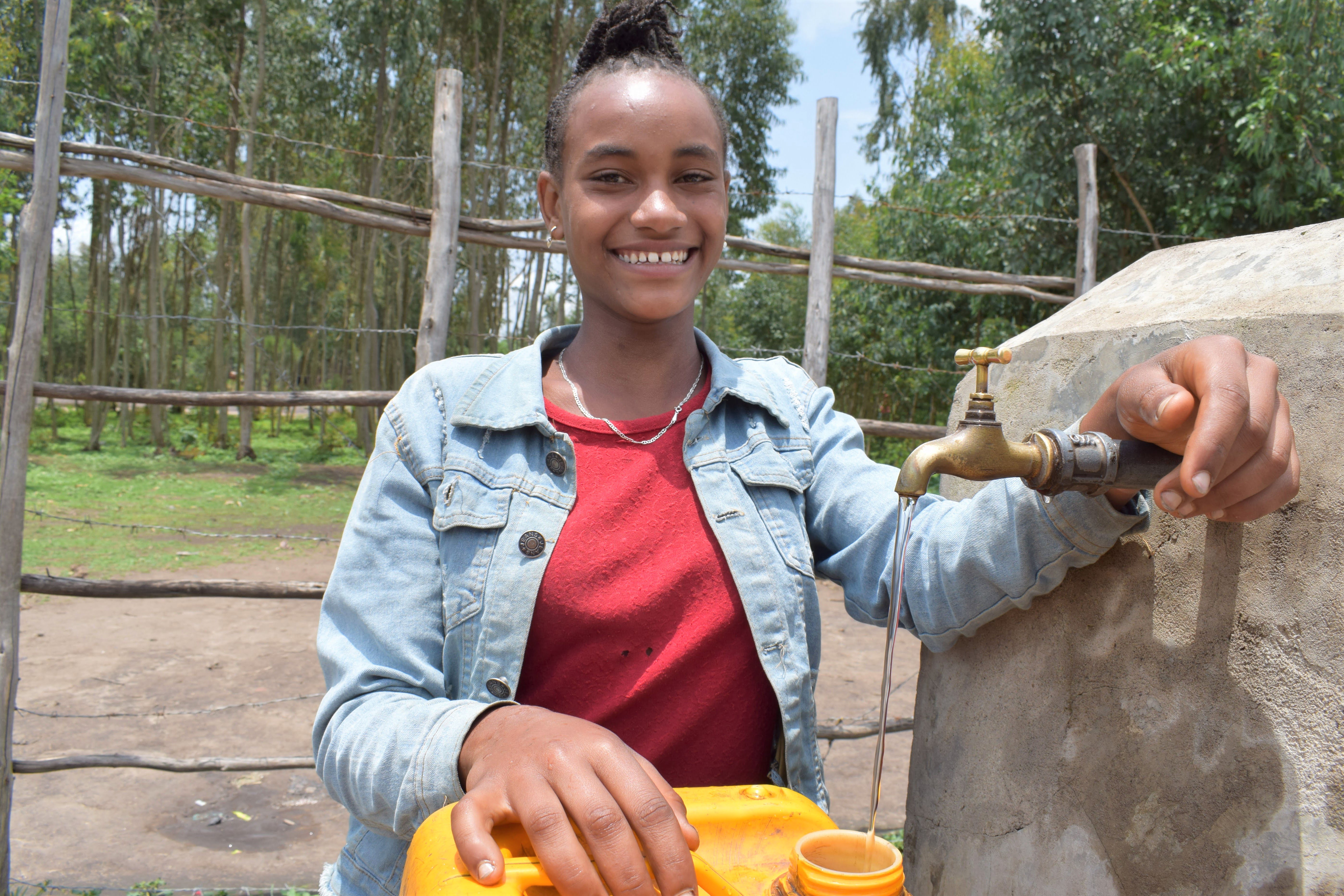 Bereket fetching water from a newly-built tap