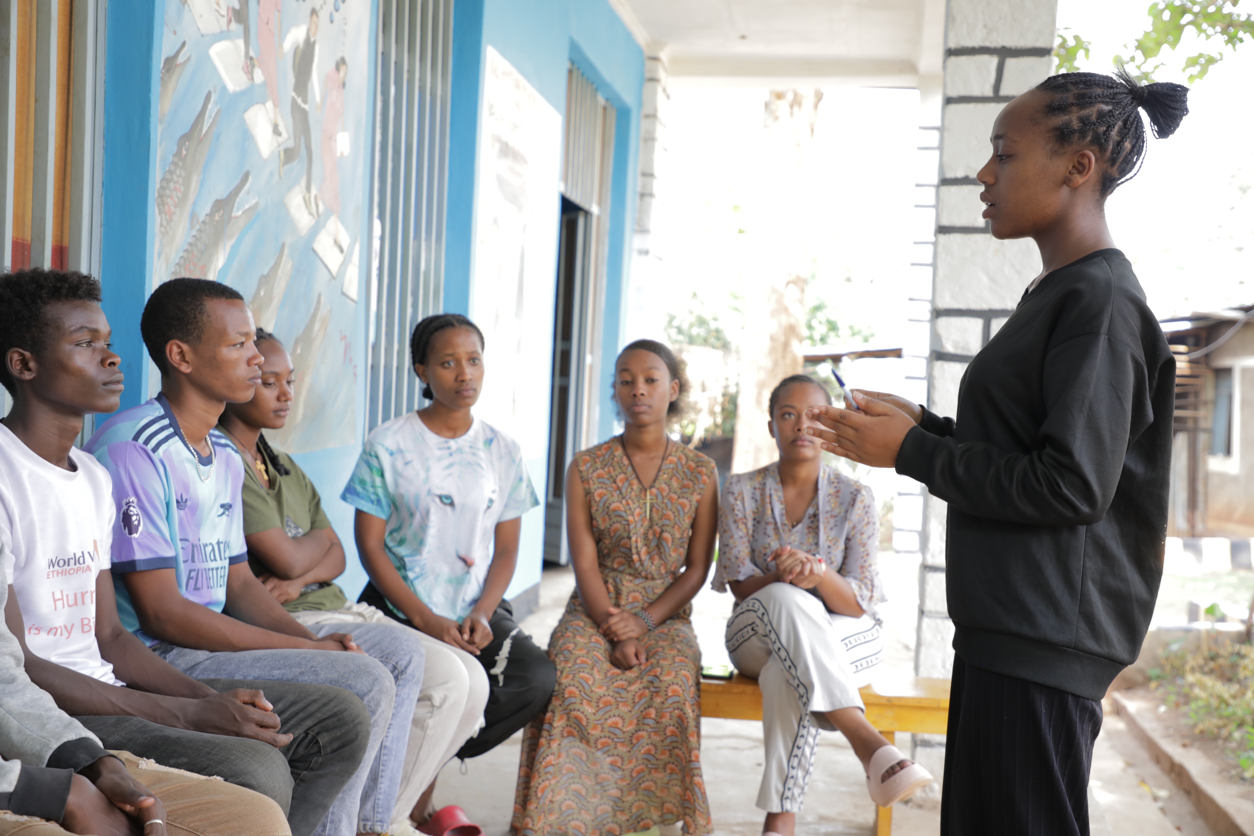 Bethel discussing with Child Parliament members in Kele