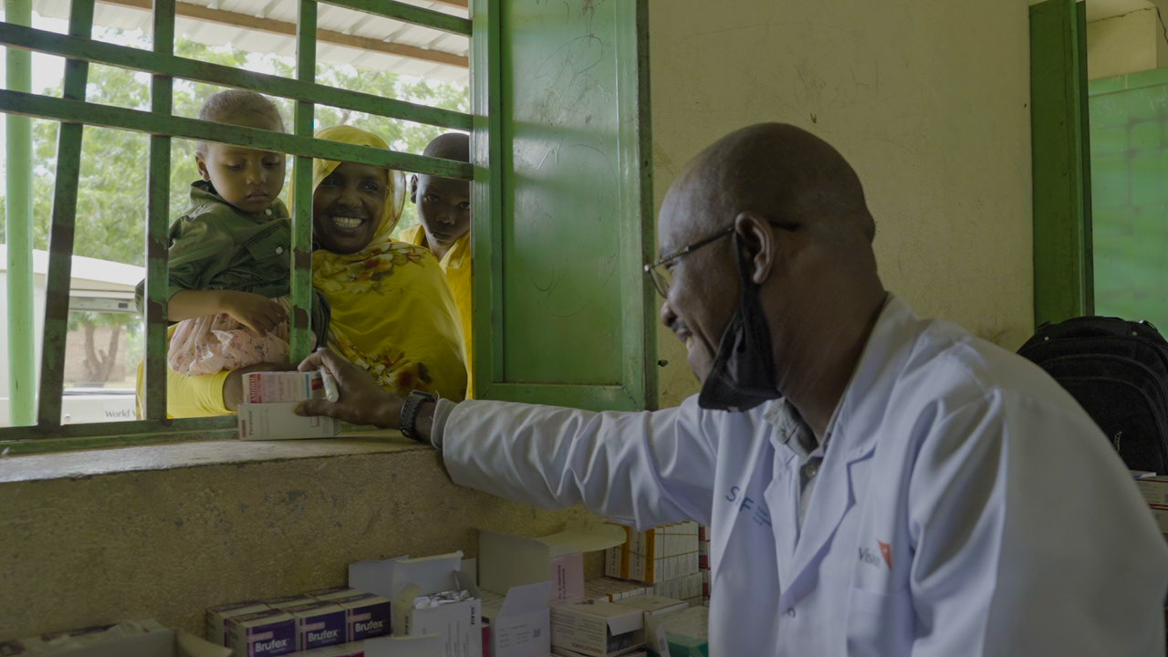 Woman is provided essential medications for her child at a World Vision Sudan clinic