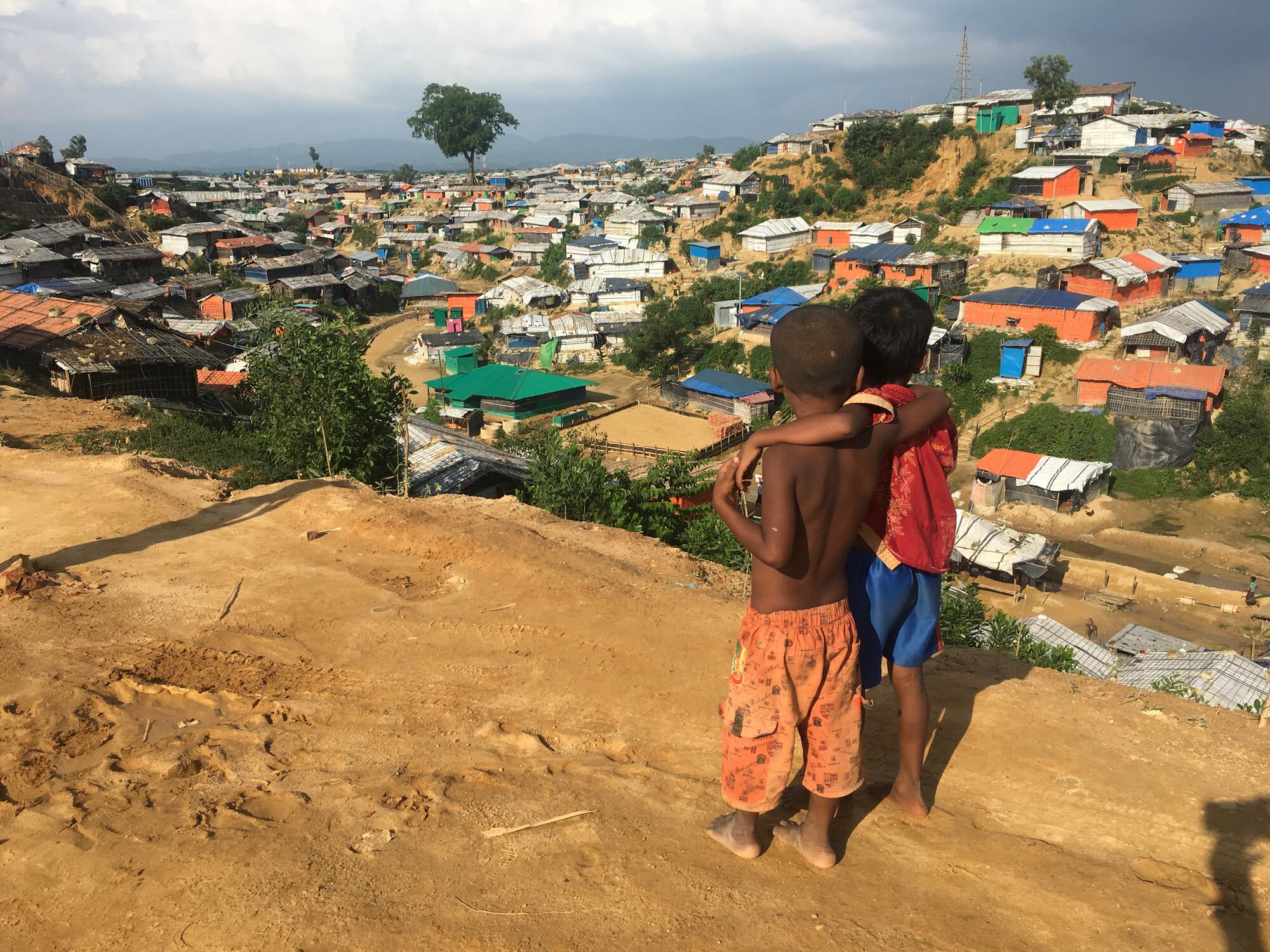 Children look over the refugee camp in Bangladesh