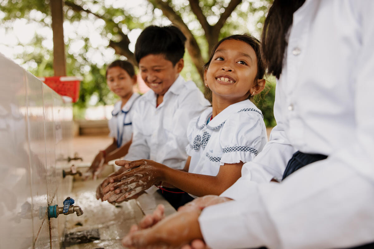 Cambodian school children washing their hands