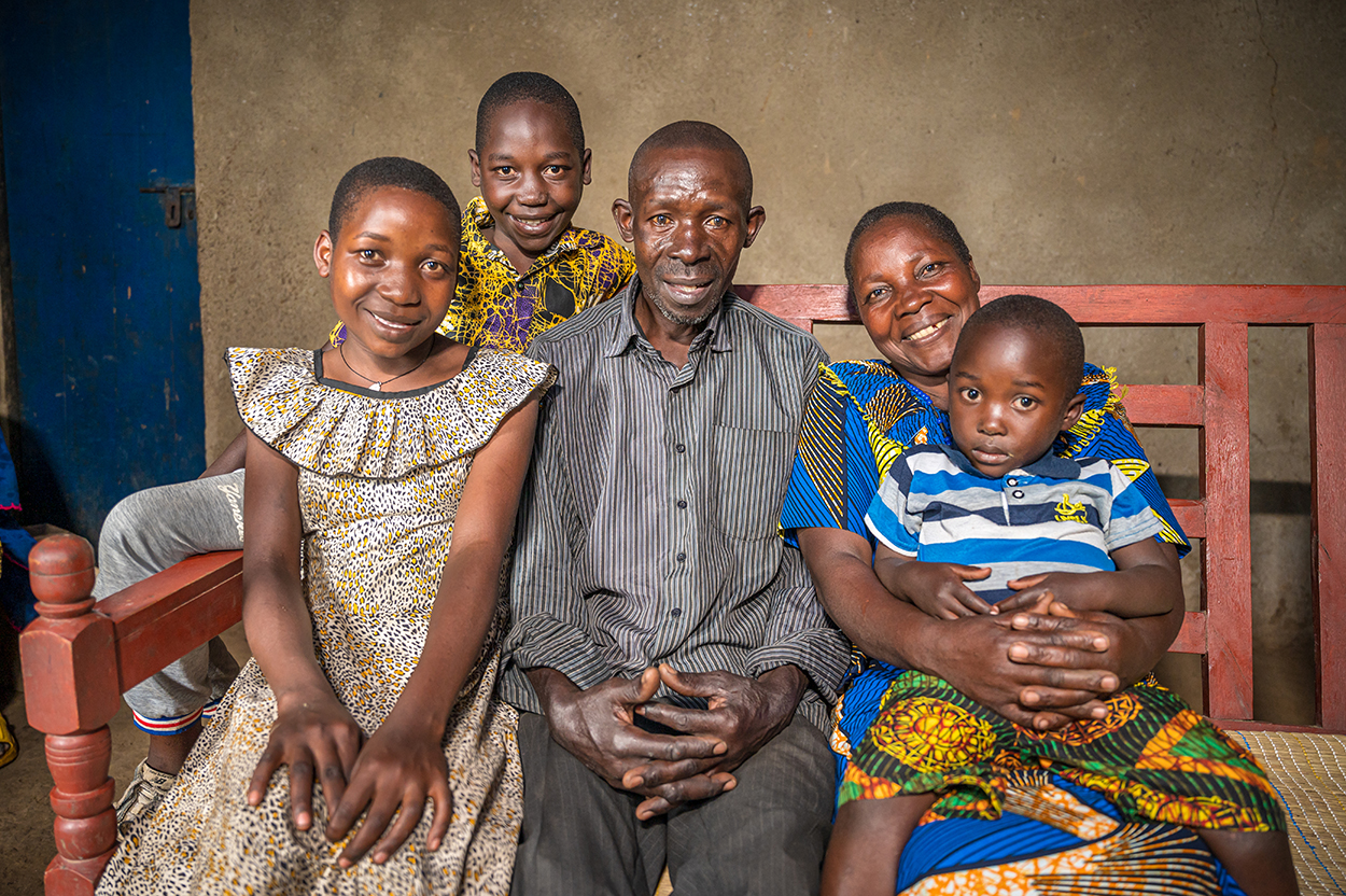 Andrew Morley, President and CEO of World Vision International sits with a family who participated in our Celebrating Families programme in Africa. 