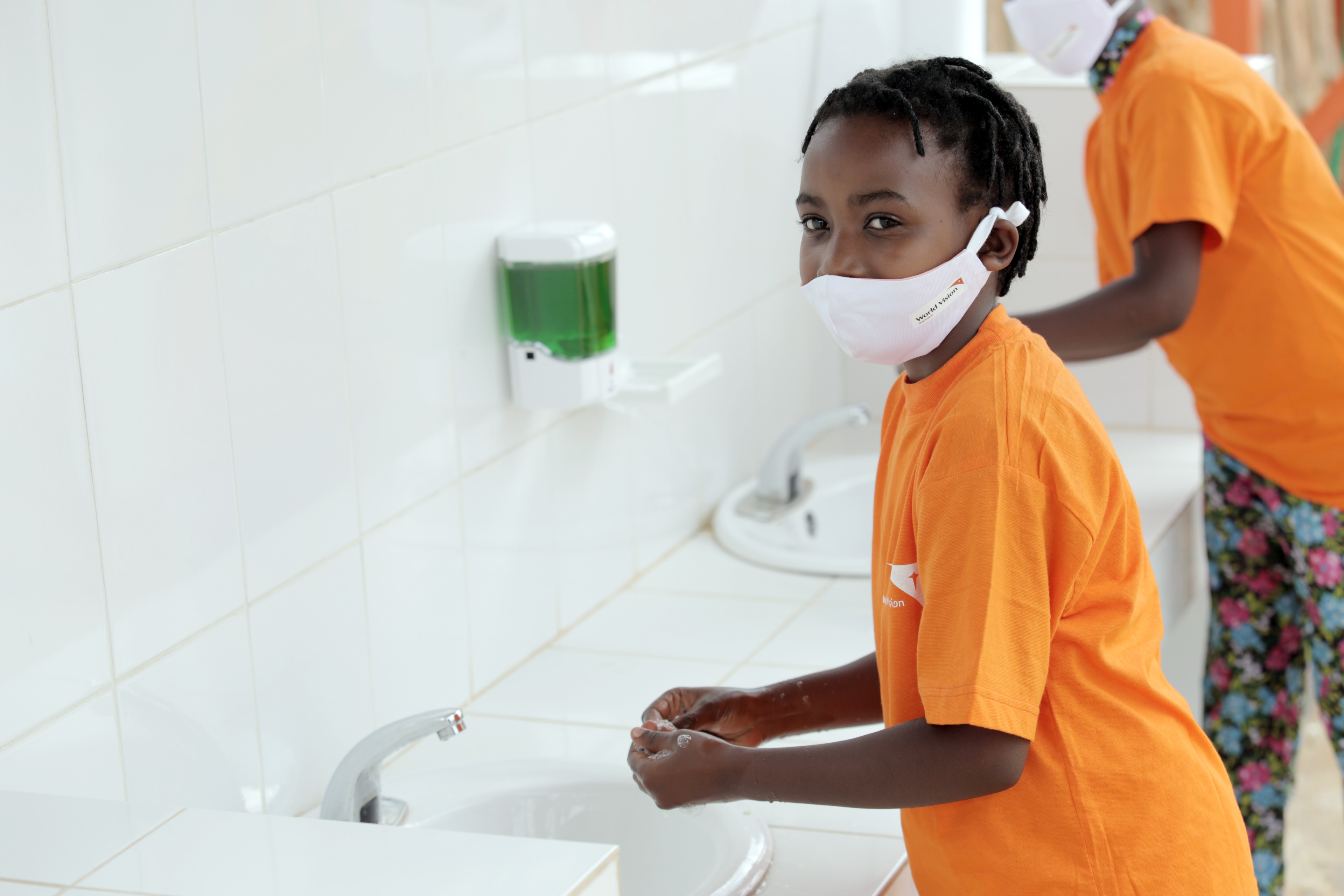 A child washing her hands at one of the newly constructed hand washing facilities