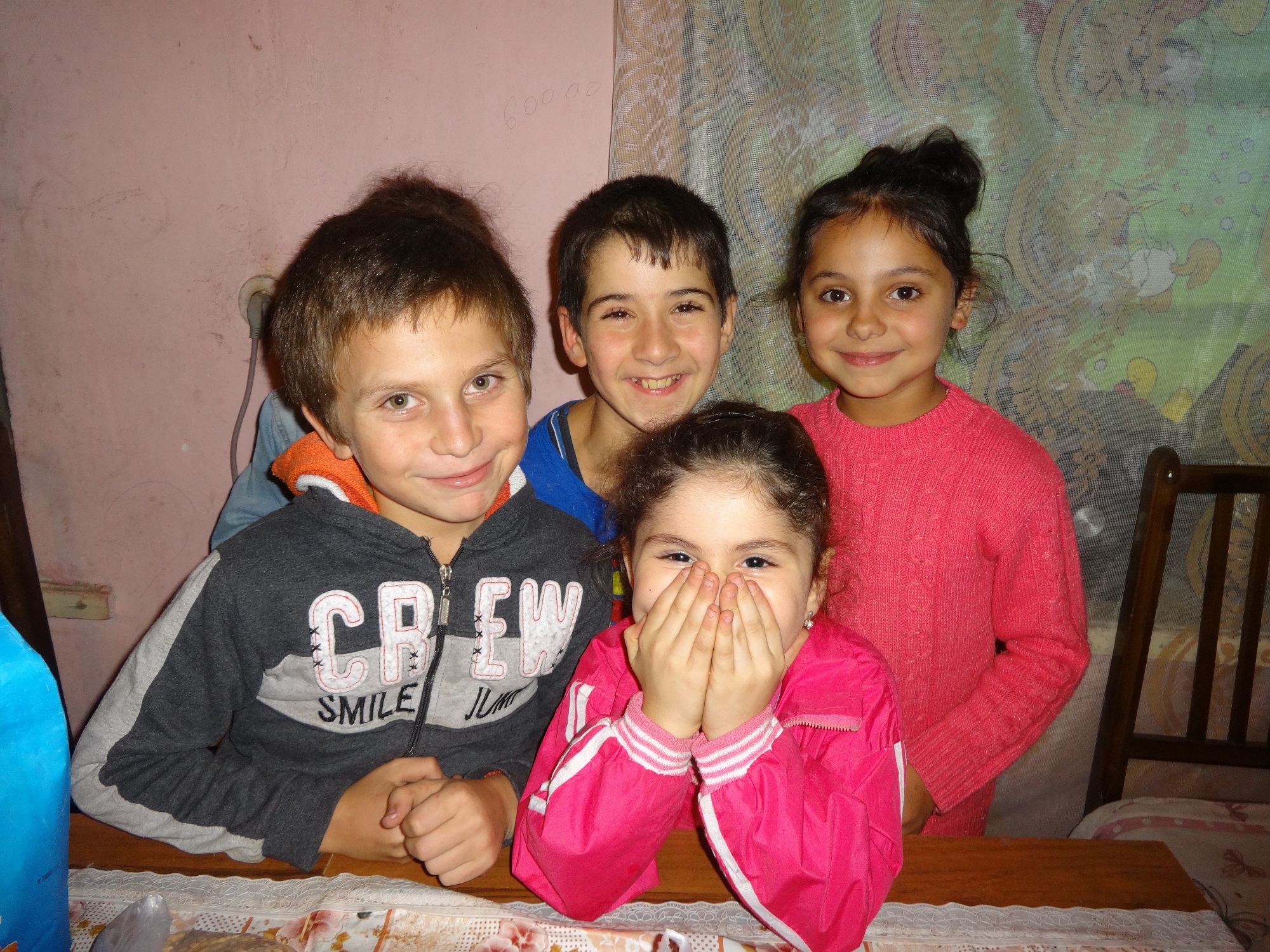 Children in Armenia smiling at the camera