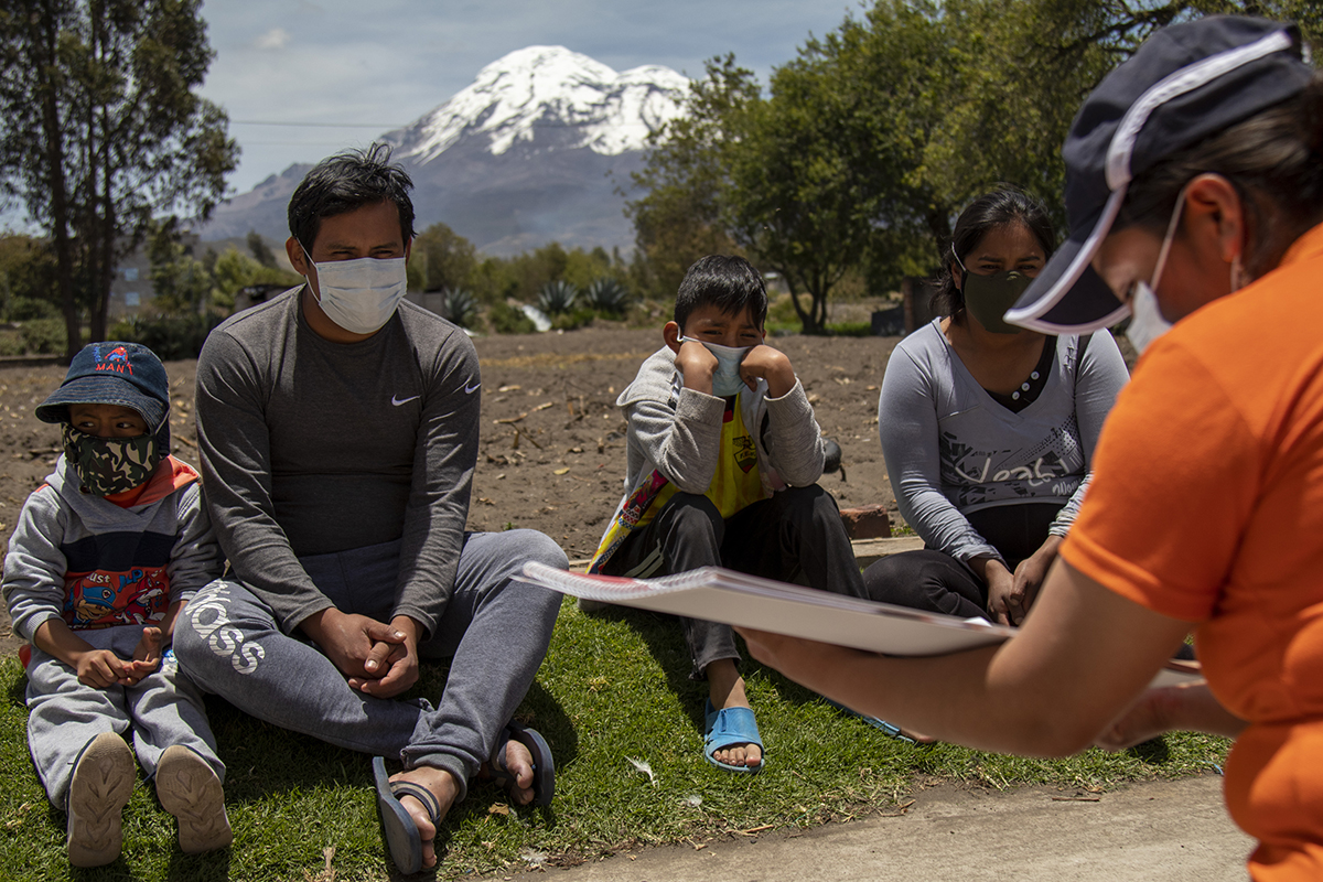 World Vision staff educate families in Ecuador on how to properly wash their hands to protect themselves from COVID-19