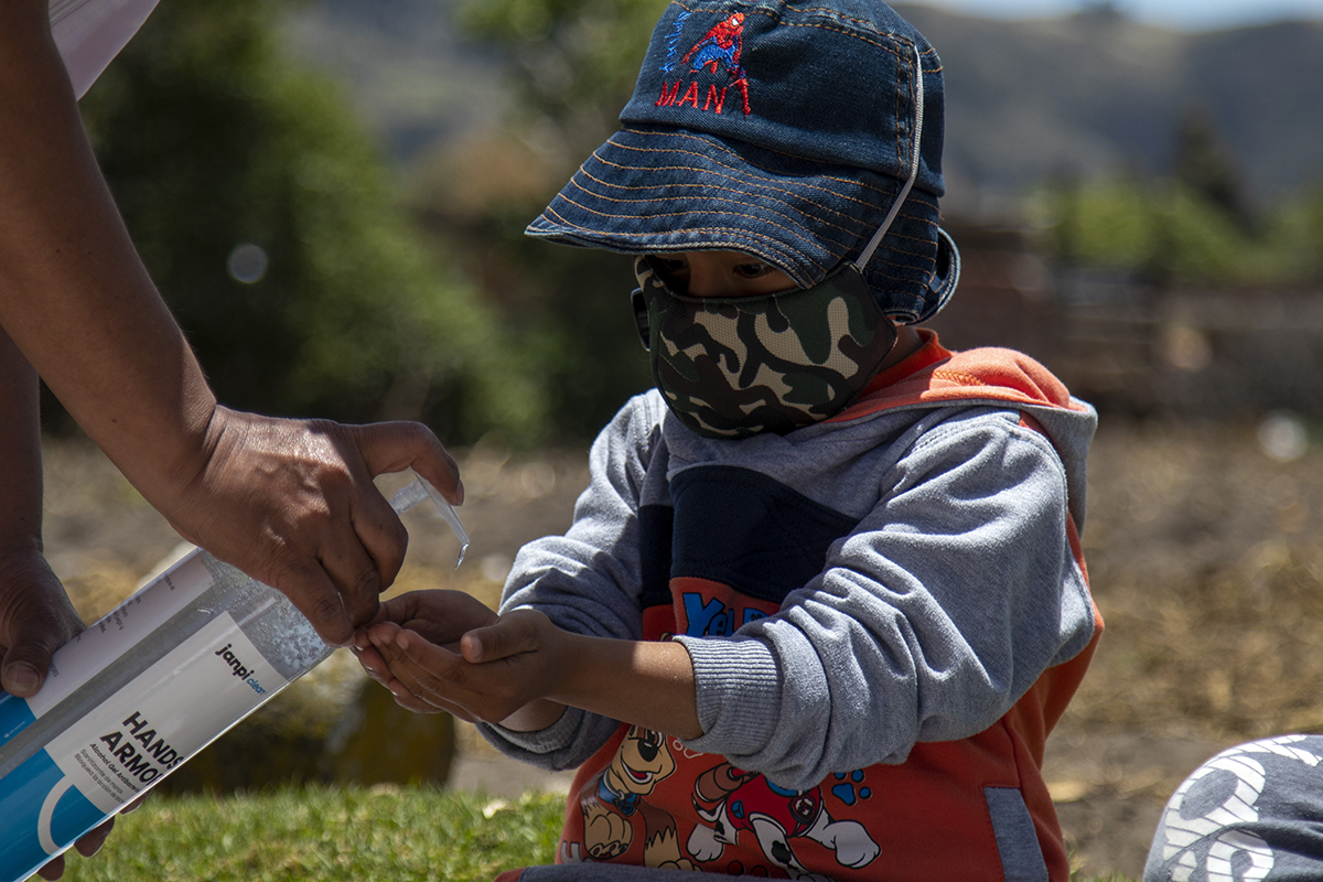 Victor a 5-year-old in Ecuador uses hand sanitizer distributed by World Vision to help protect himself and his family from COVID-19
