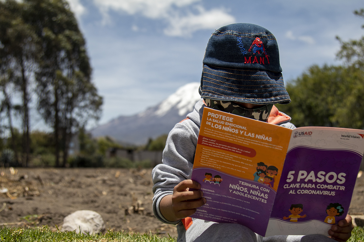 Victor, a 5-year-old from Ecuador reads about how to protect himself and his family from COVID-19