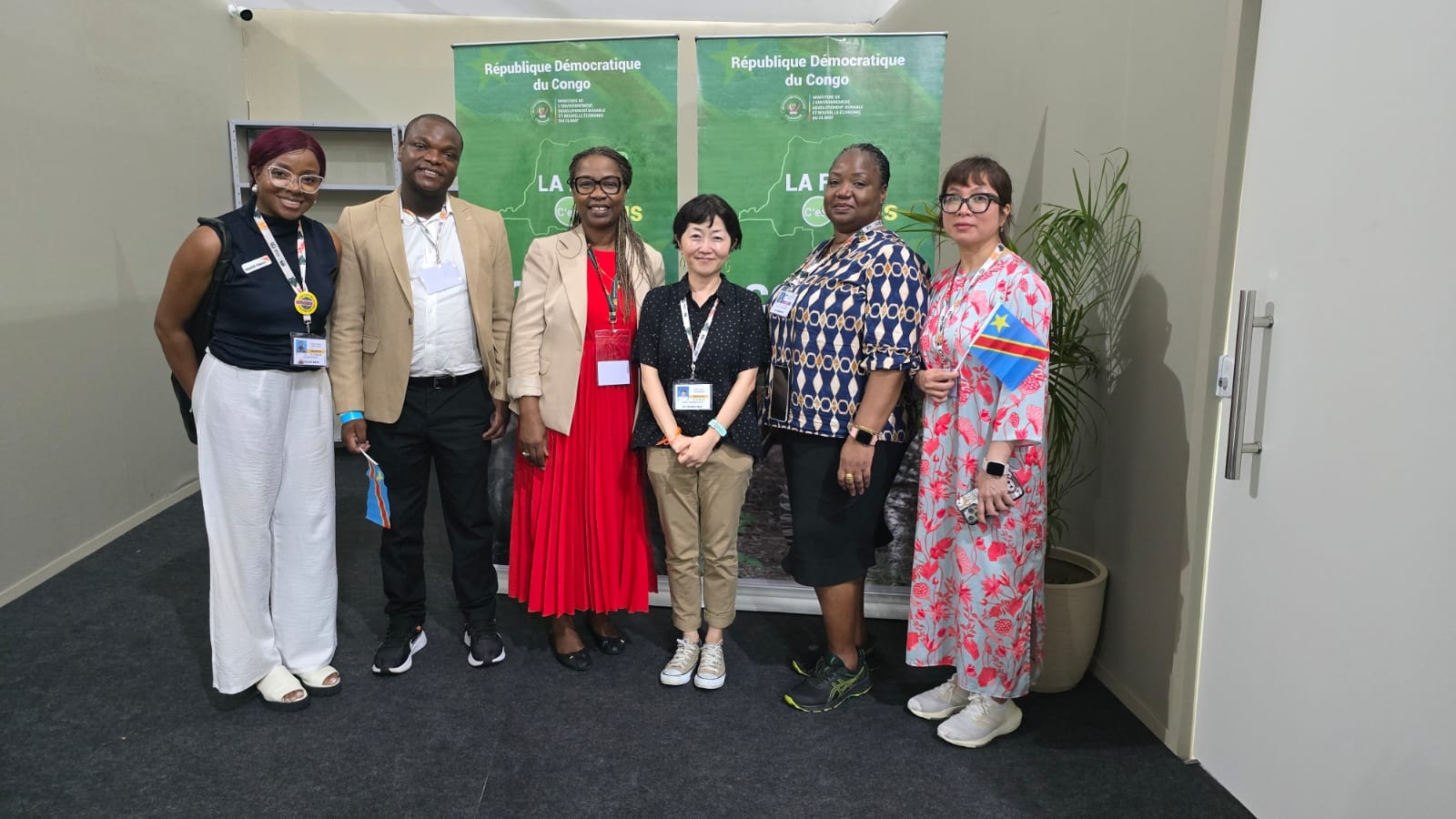 Members of the World Vision delegation and the Democratic Republic of the Congo delegation at COP30, pictured at the DRC pavilion.