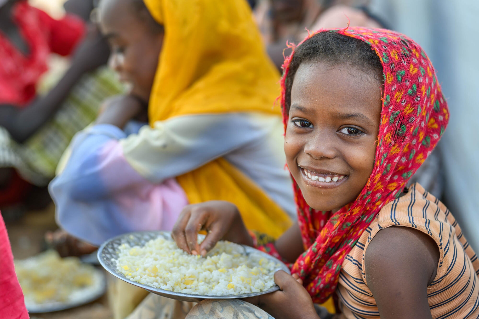 Sudanese girl at a World Vision school feeding program in Farchana Refugee Camp, Chad