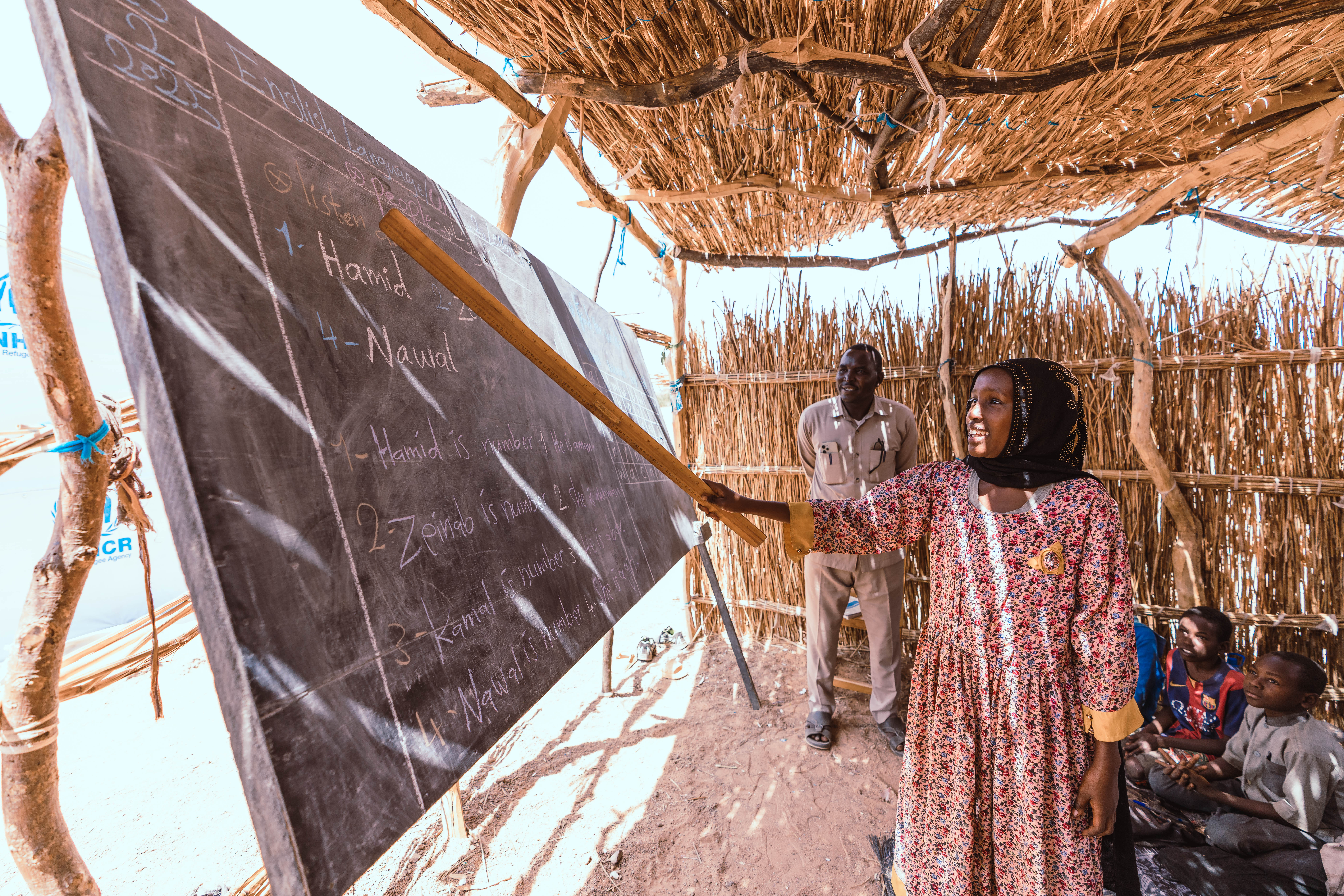 During a lesson in Farchana Refugee Camp, Saba practises new words with enthusiasm. 