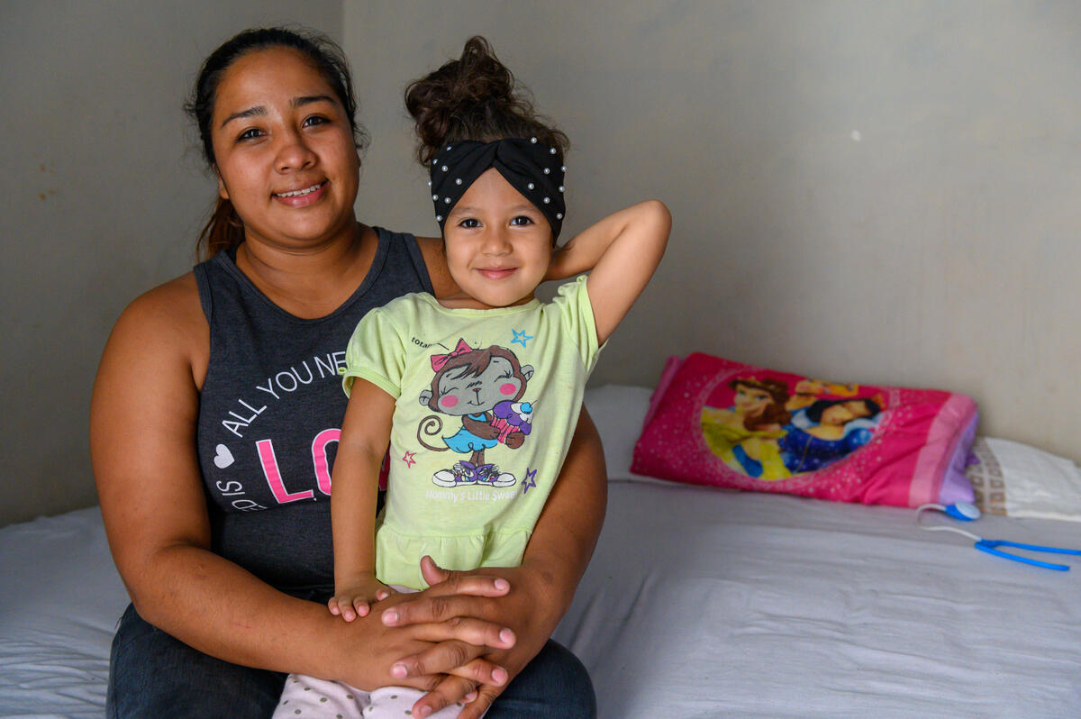 Heidy from Honduras with her young daughter