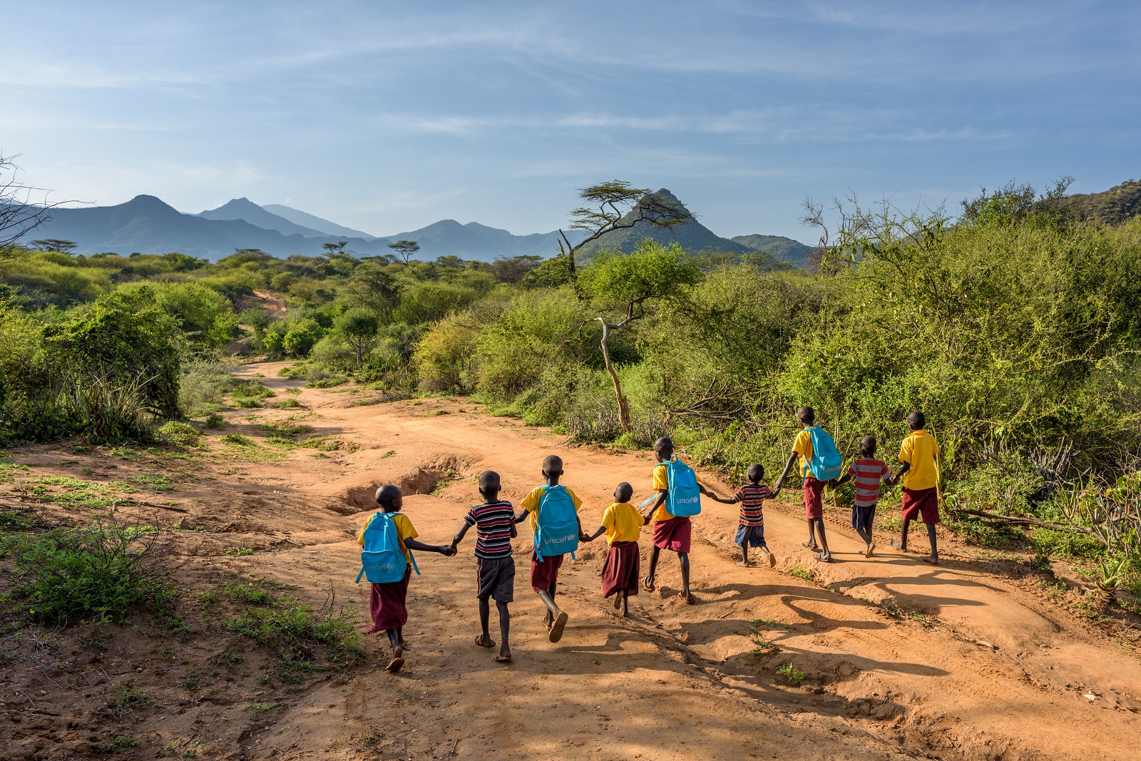 Cheru and her friends walk to Kesot Primary School. Now that they have clean water, they no longer have to gather water to and from school. 