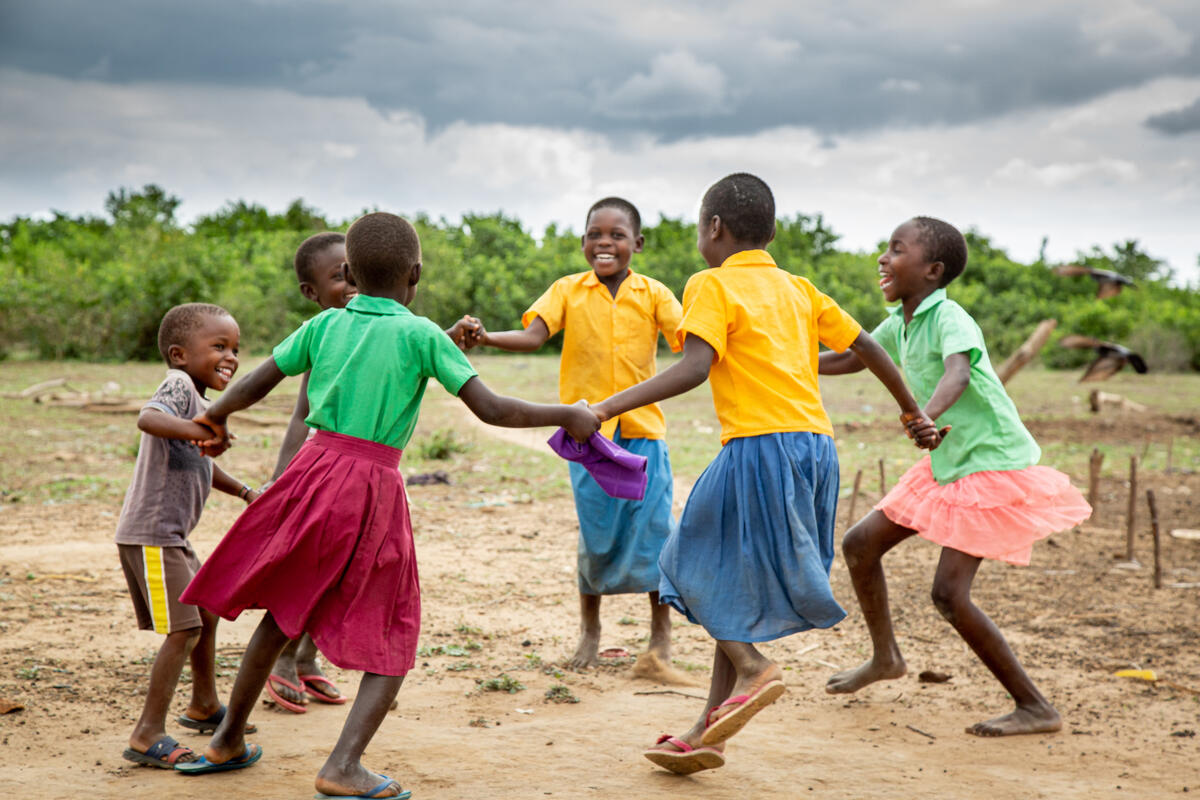 Children play joyfully on full tummies in Kenya